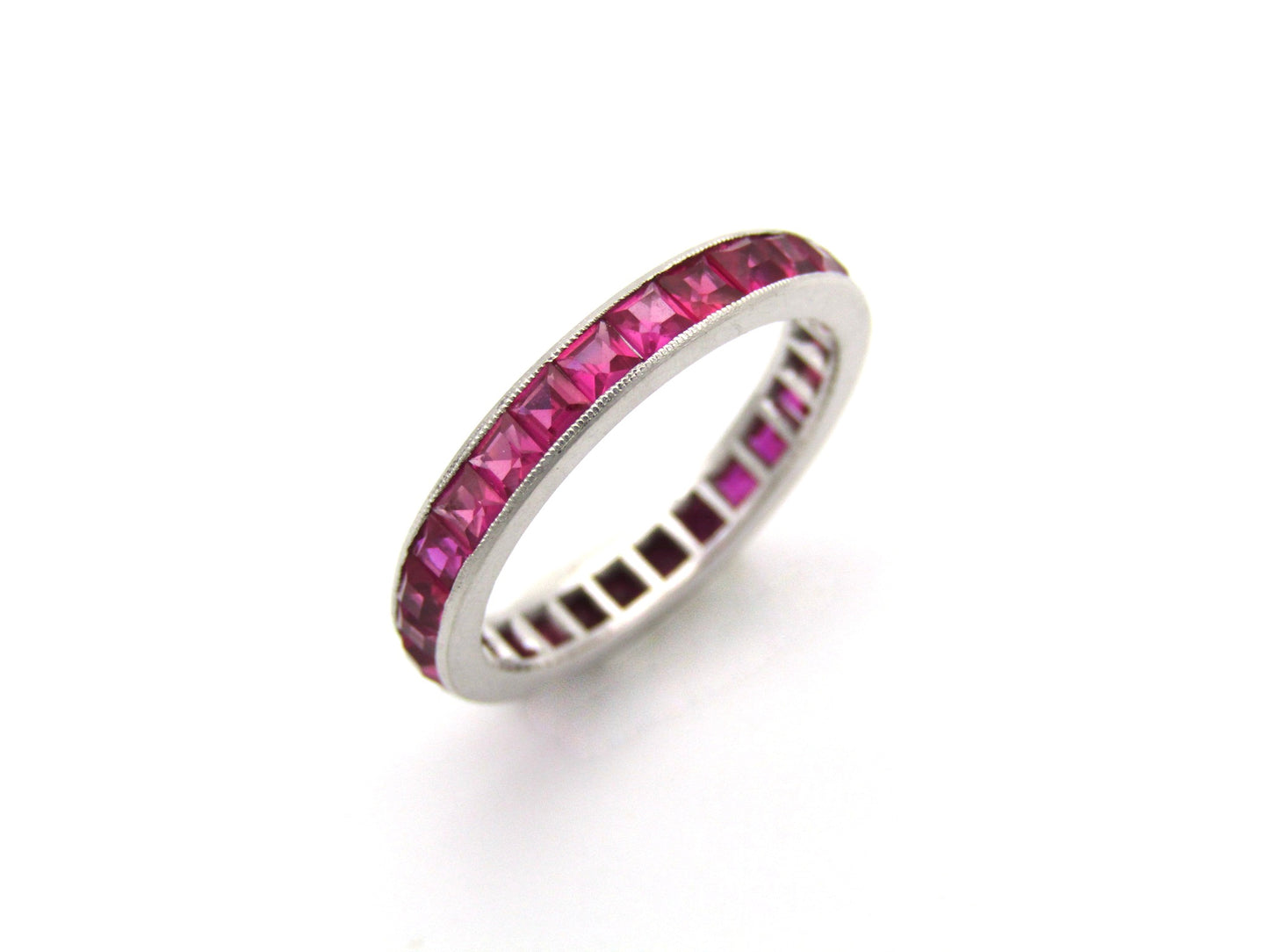 Platinum synthetic ruby eternity ring, circa 1990's.