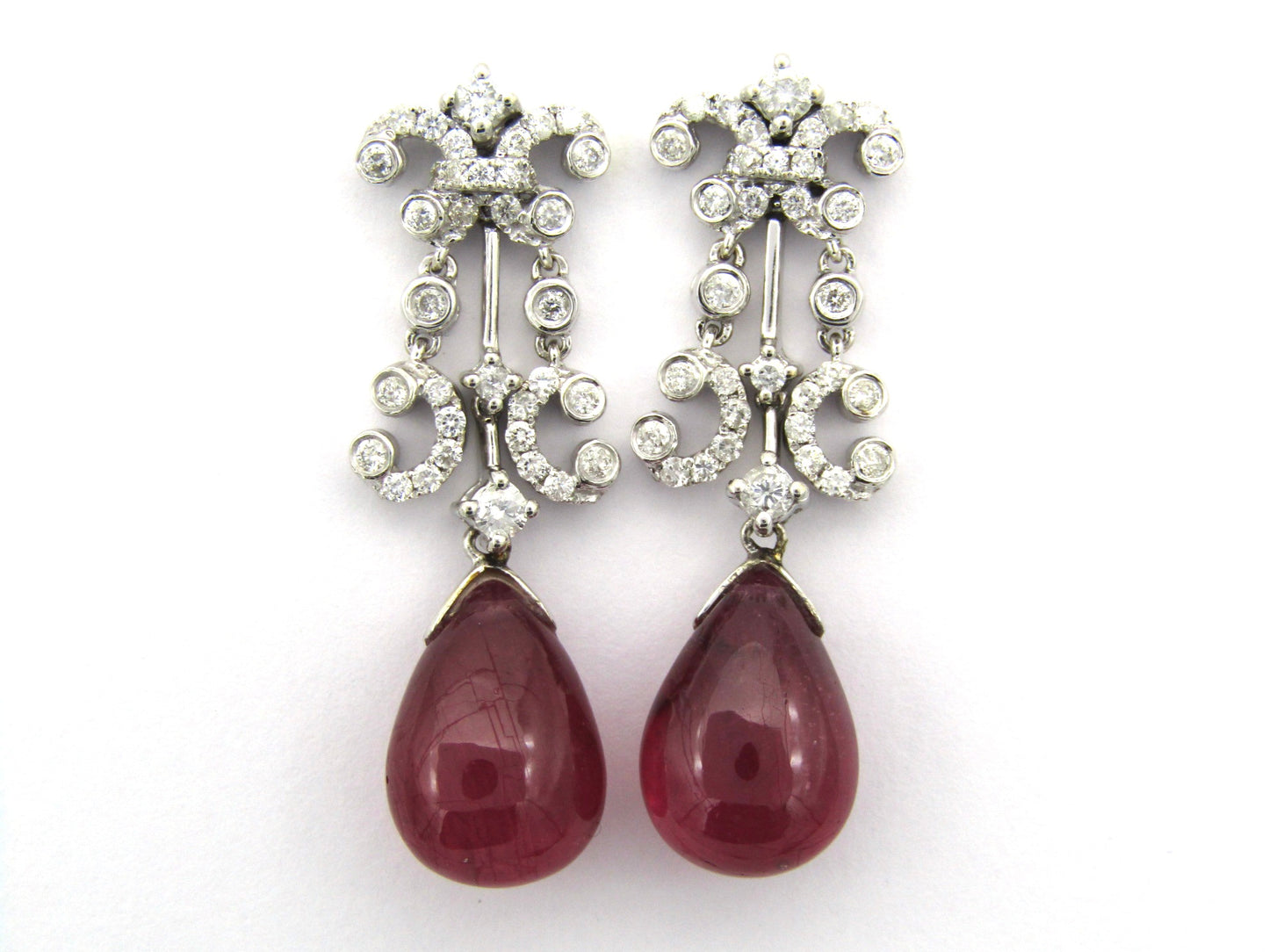 18K gold glass-filled ruby and diamond drop earrings.