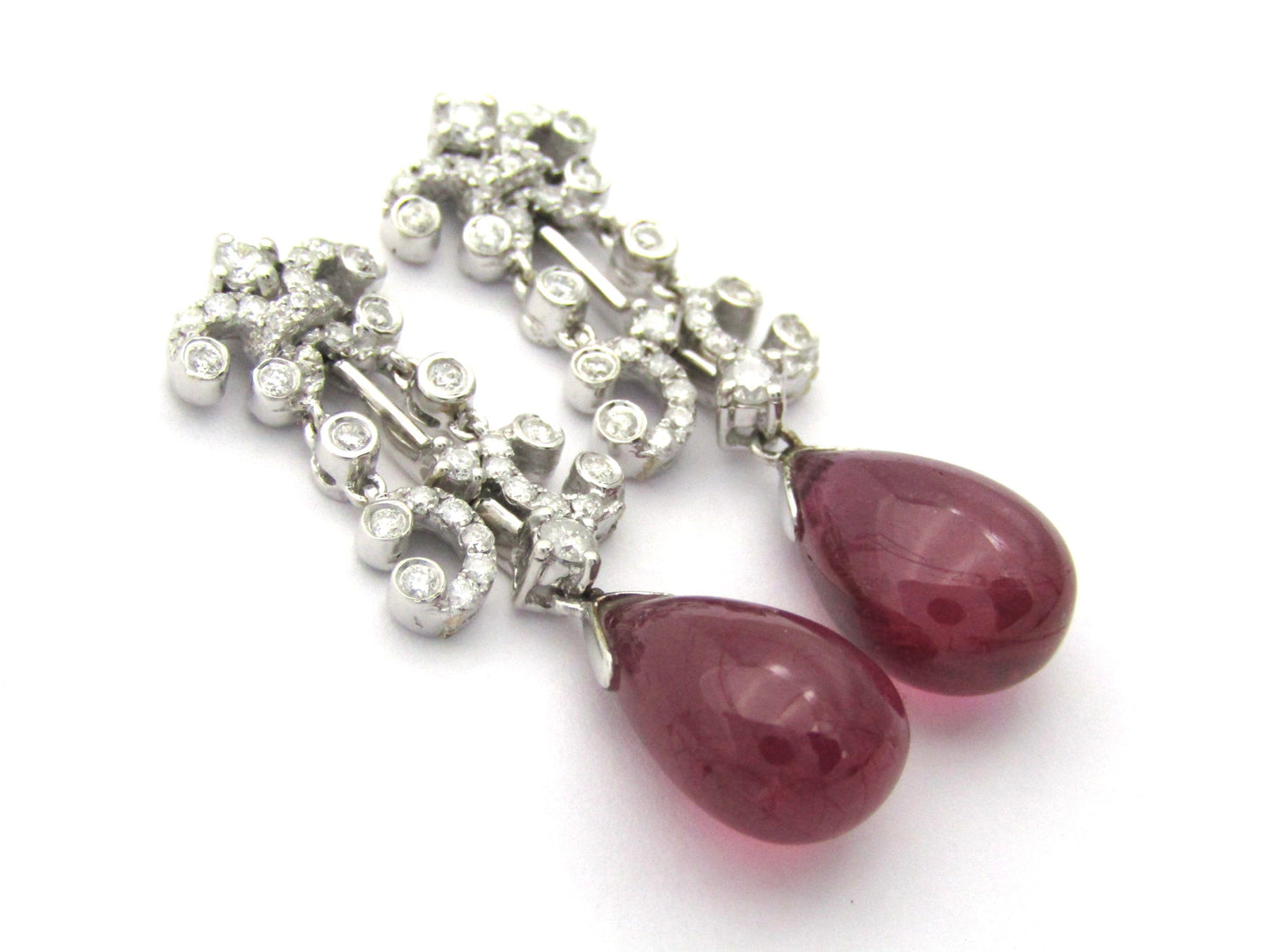 18K gold glass-filled ruby and diamond drop earrings.