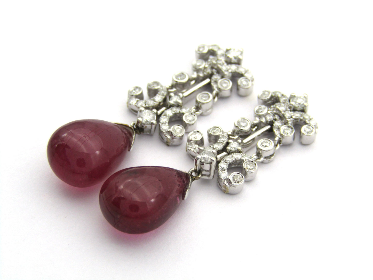 18K gold glass-filled ruby and diamond drop earrings.