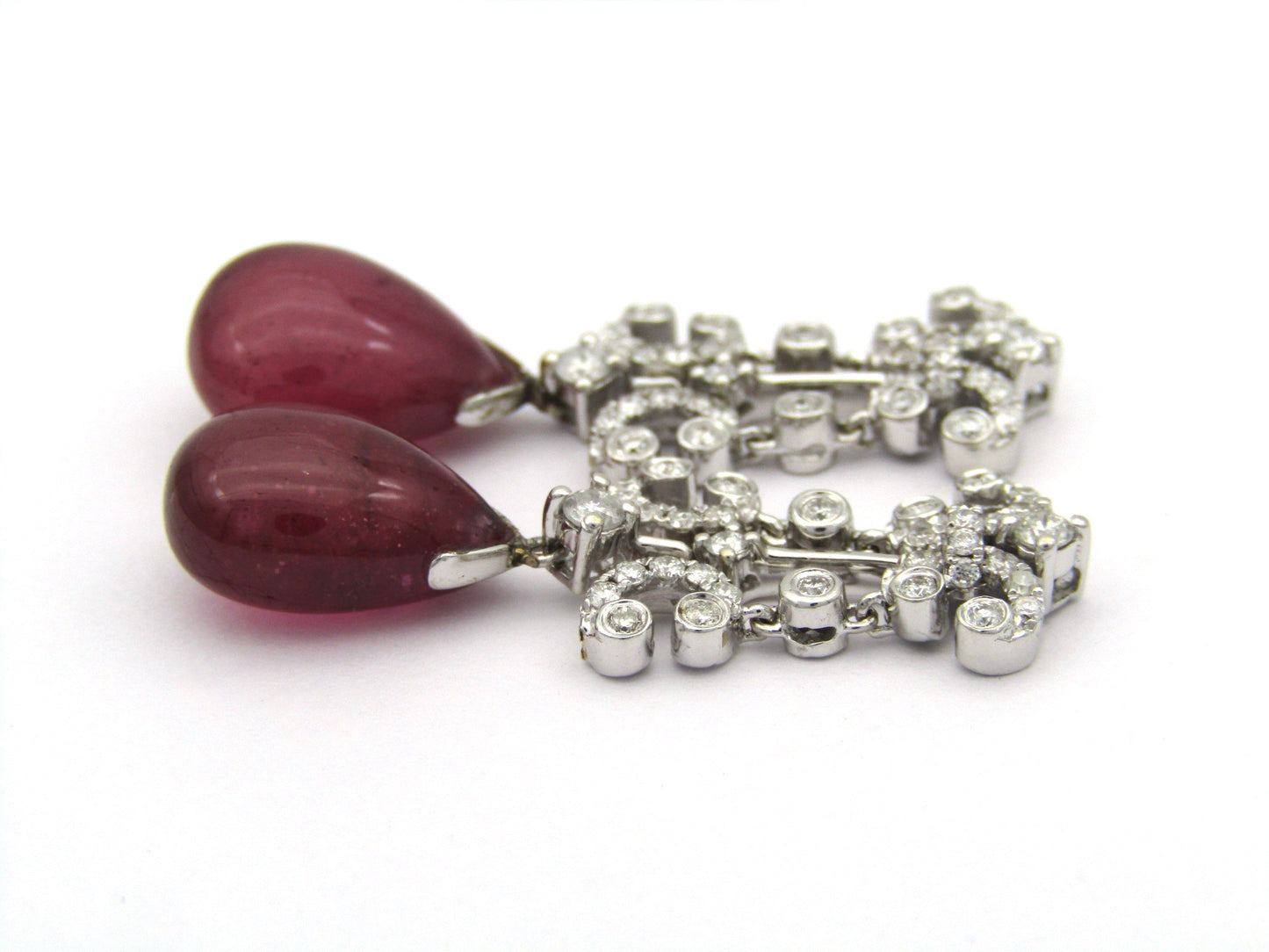 18K gold glass-filled ruby and diamond drop earrings.