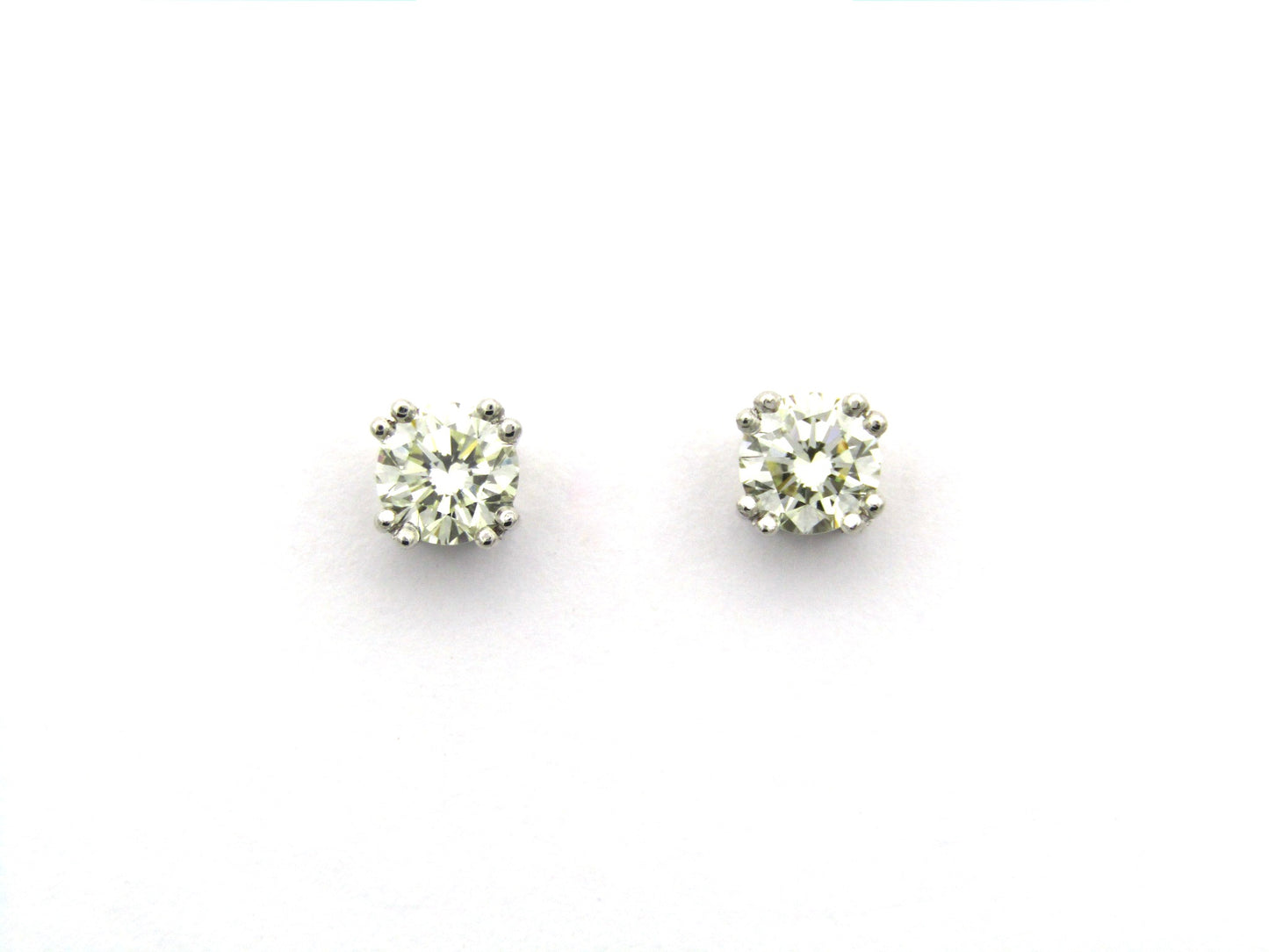 9K gold diamond studs.