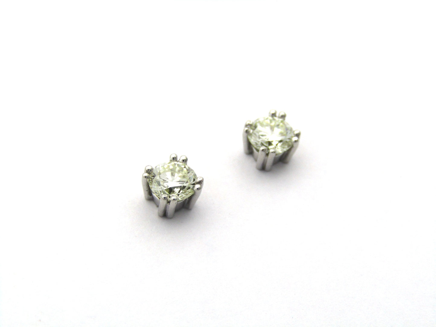 9K gold diamond studs.