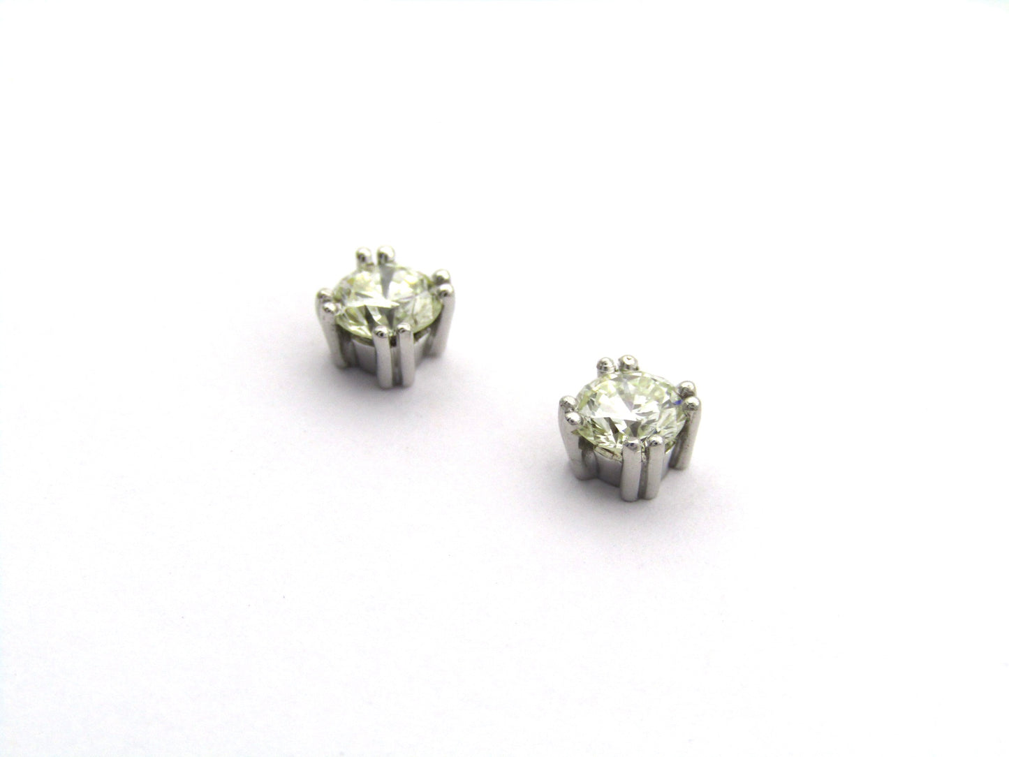 9K gold diamond studs.