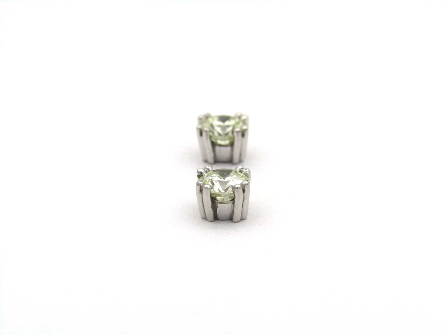9K gold diamond studs.