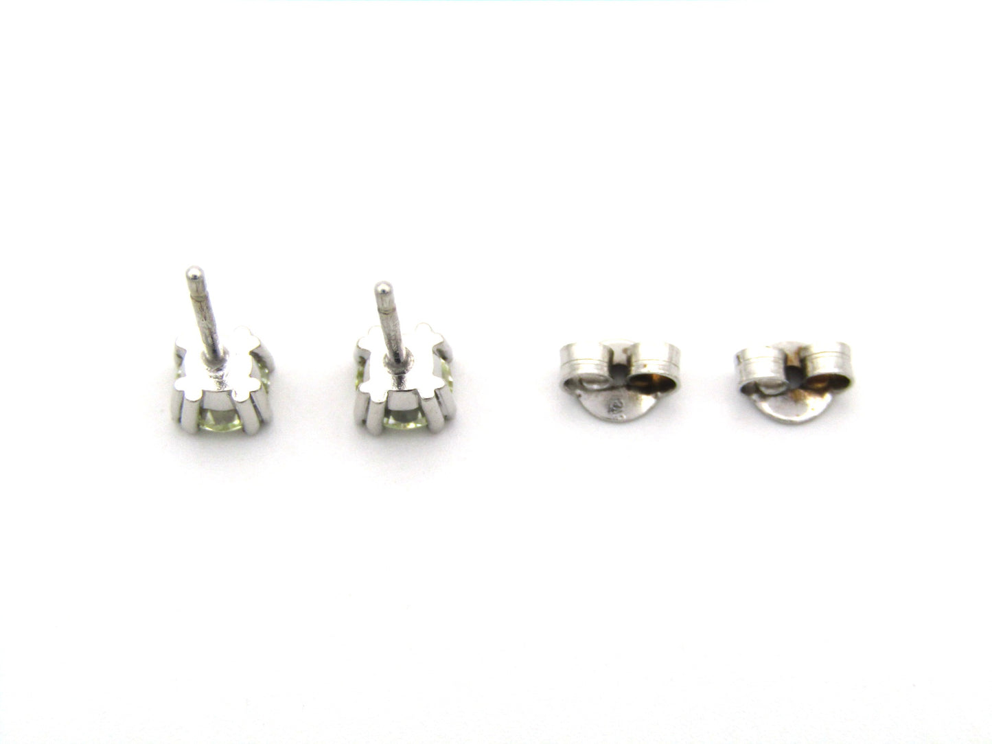 9K gold diamond studs.