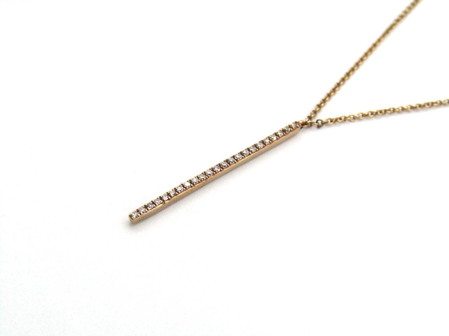 9K gold diamond bar necklace.
