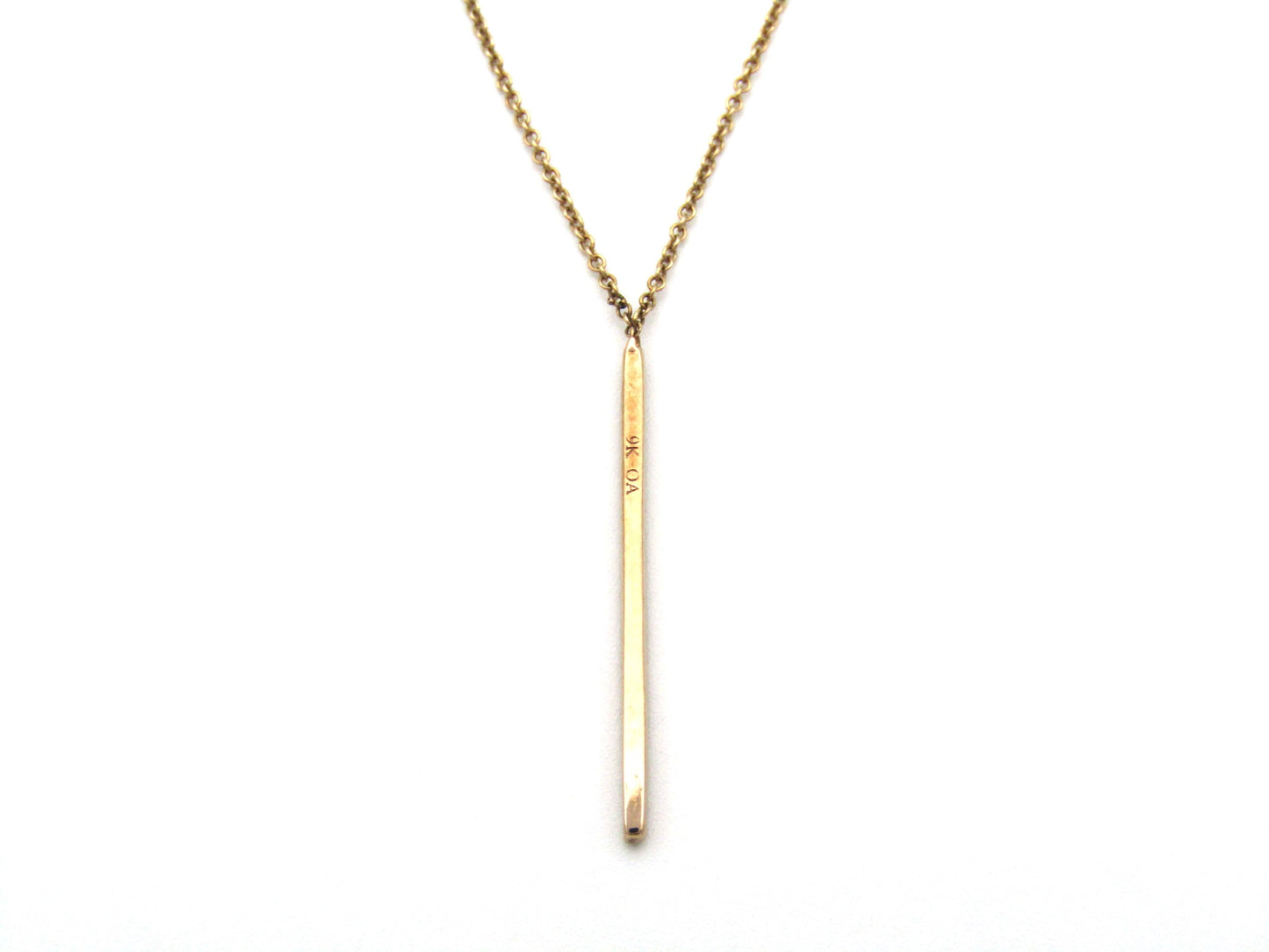 9K gold diamond bar necklace.