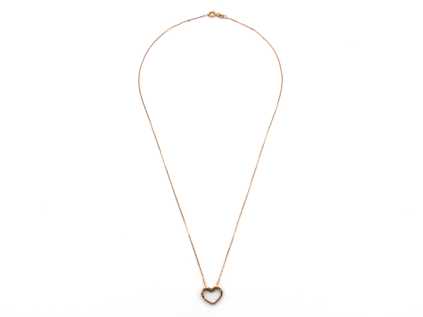 9K gold diamond heart pendant.