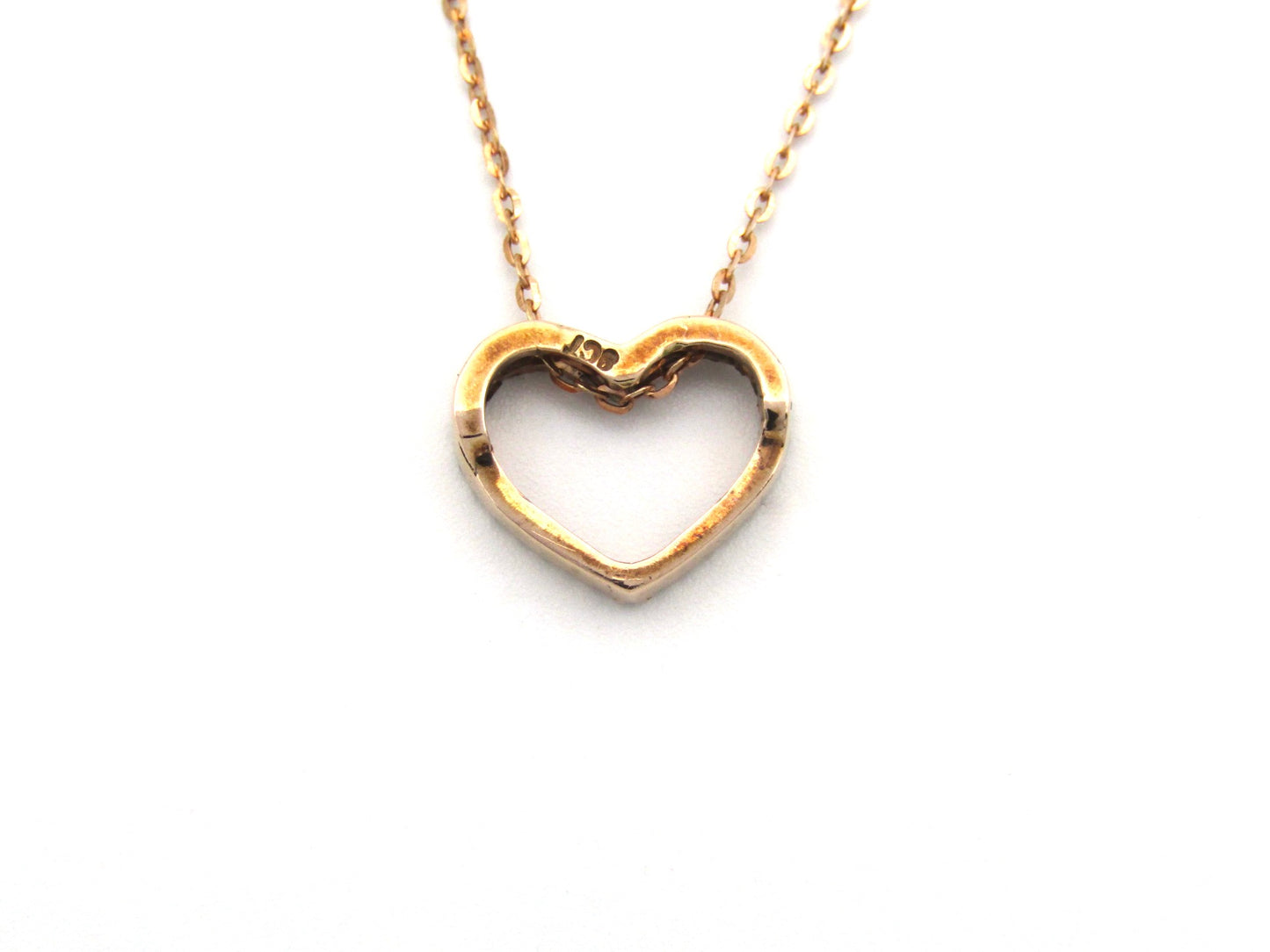 9K gold diamond heart pendant.
