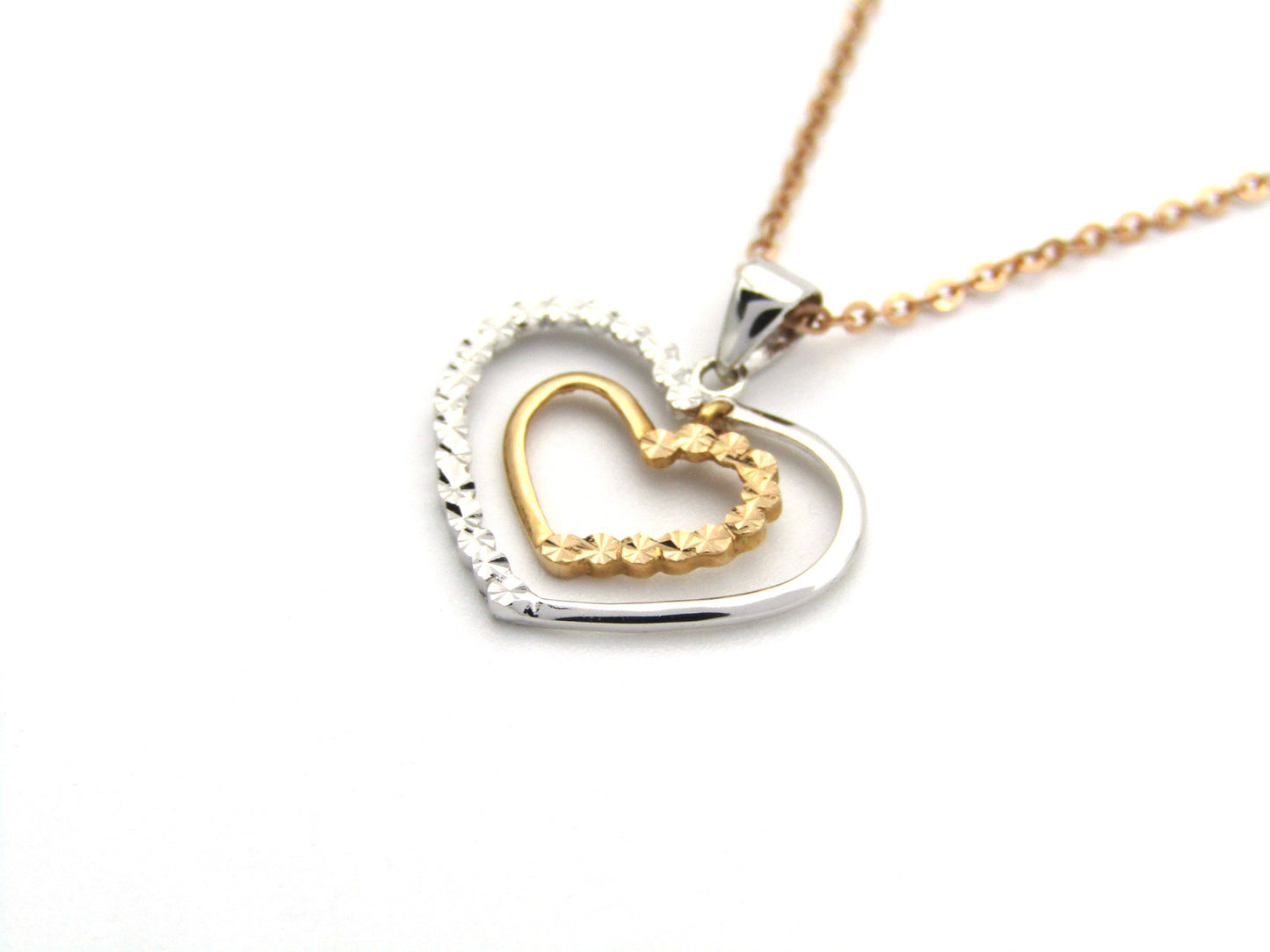 18K gold double-heart pendant.
