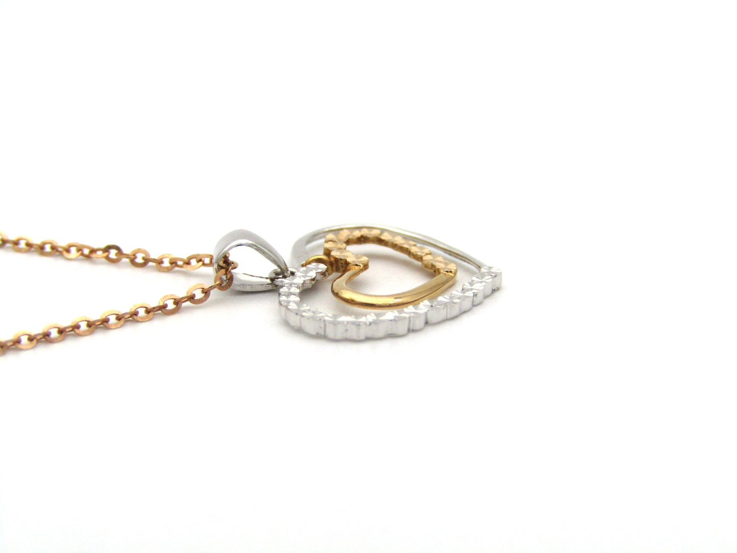18K gold double-heart pendant.