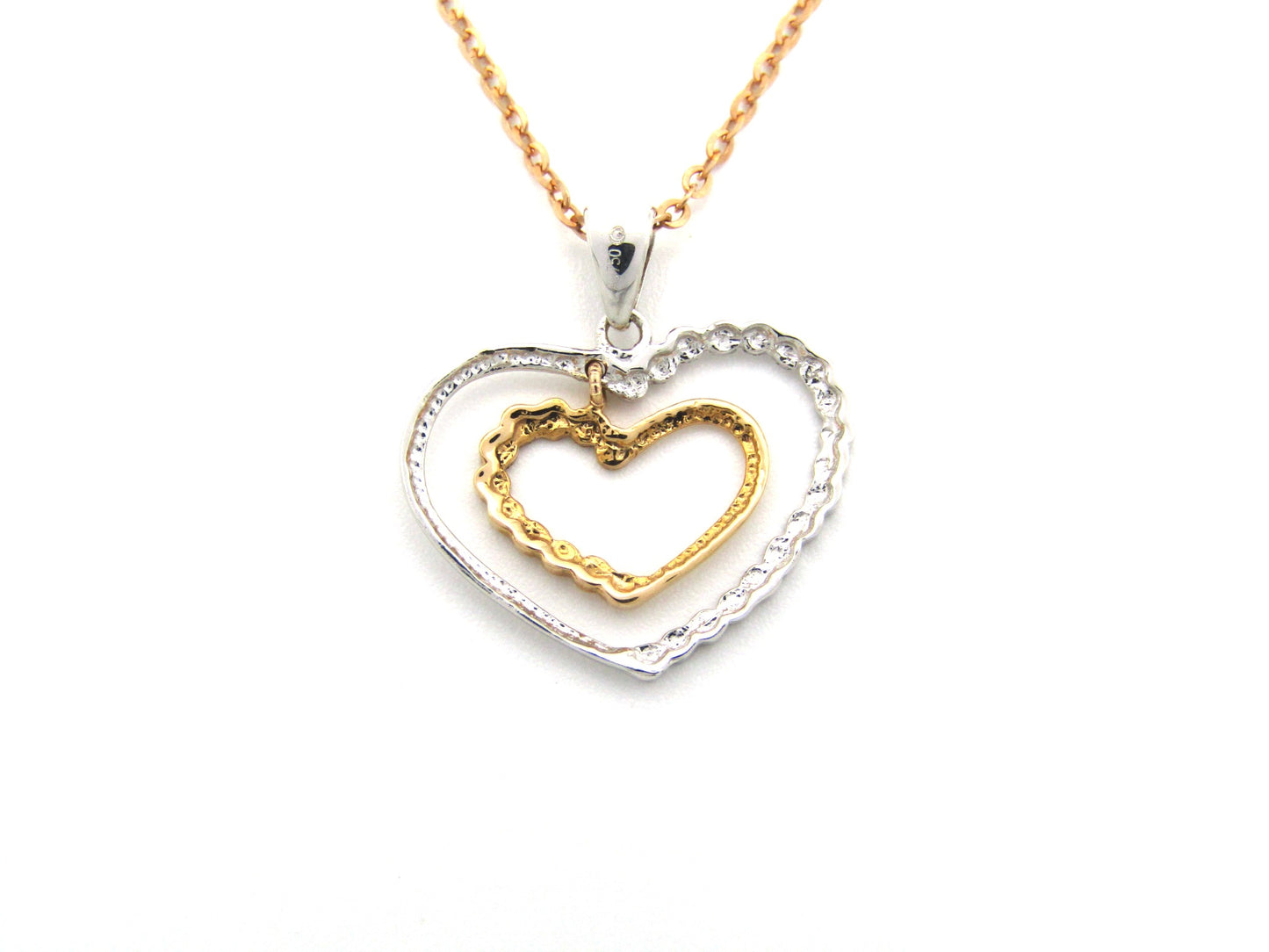 18K gold double-heart pendant.
