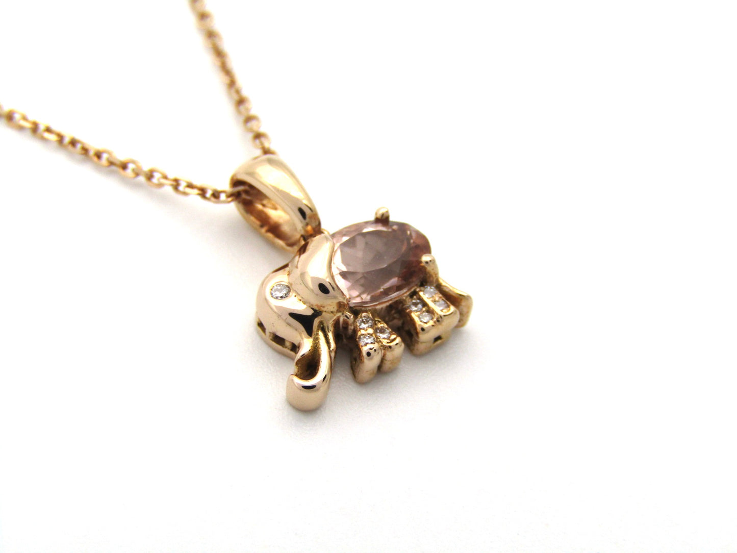 18K gold morganite and diamond elephant pendant.