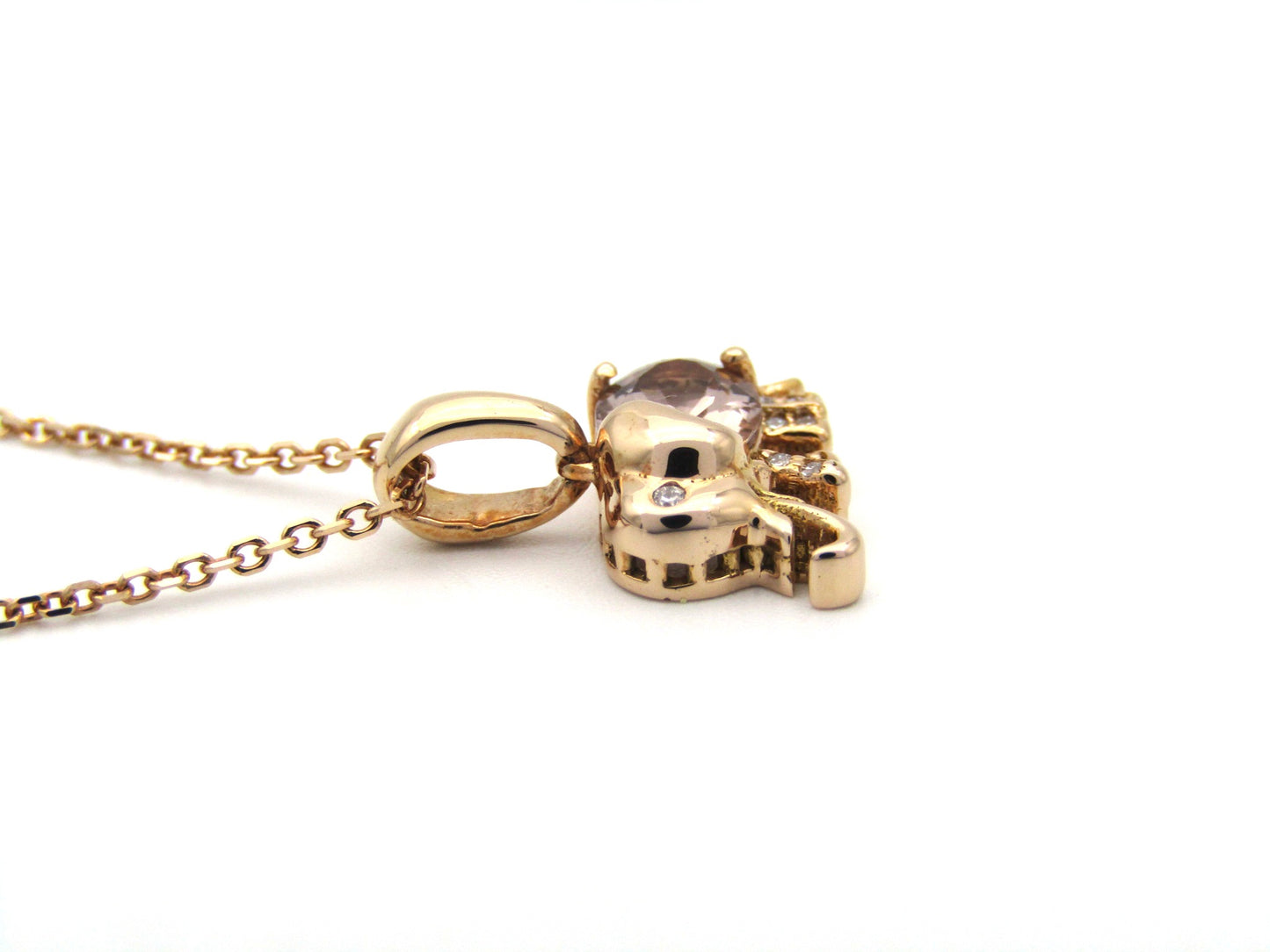 18K gold morganite and diamond elephant pendant.