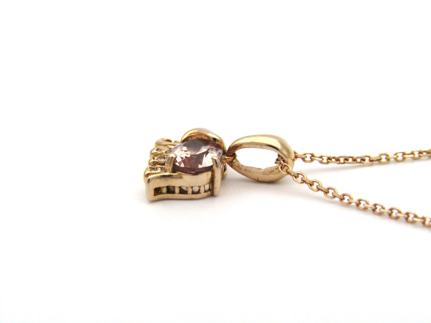 18K gold morganite and diamond elephant pendant.
