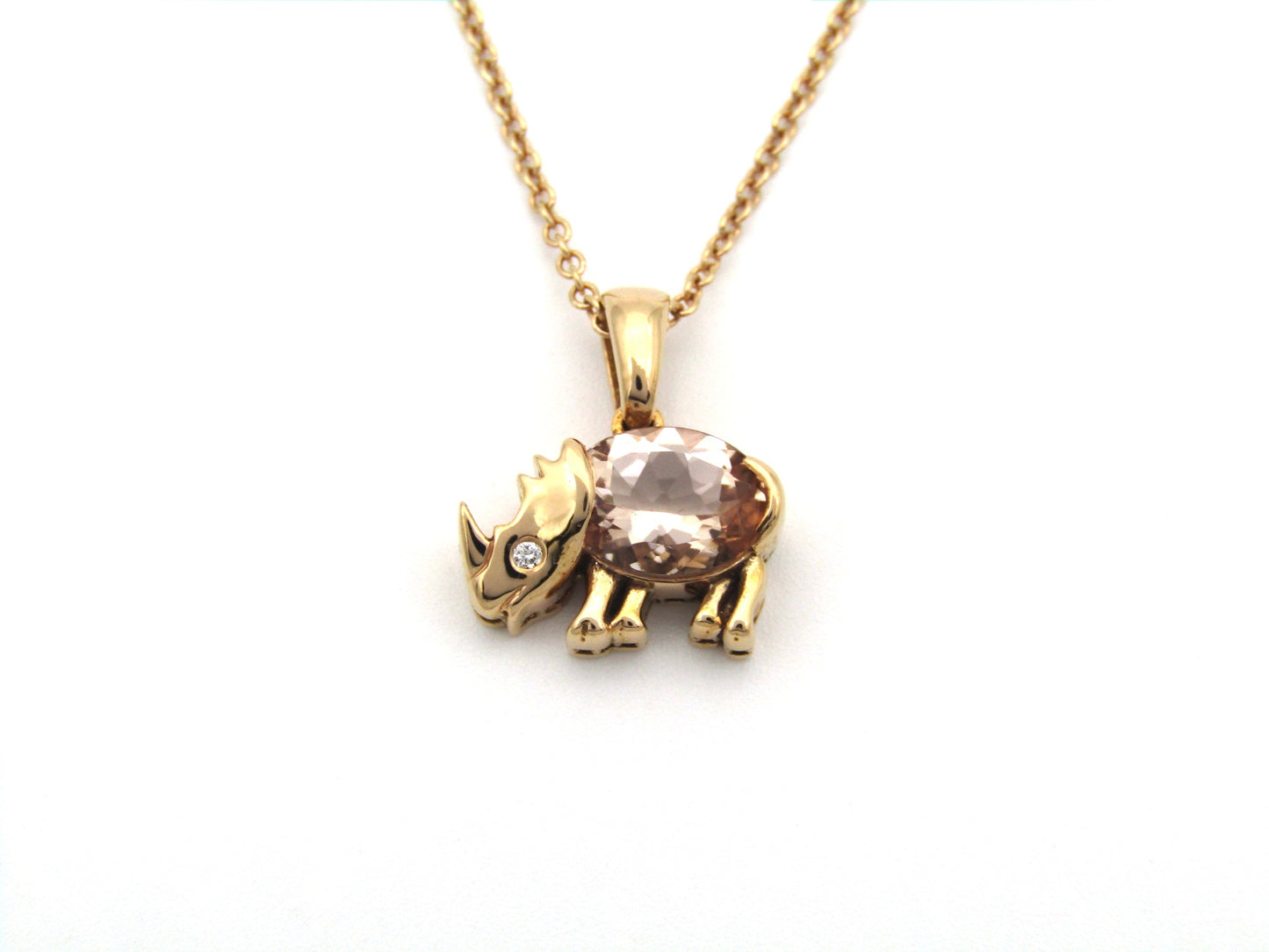 18K gold morganite and diamond rhino pendant.