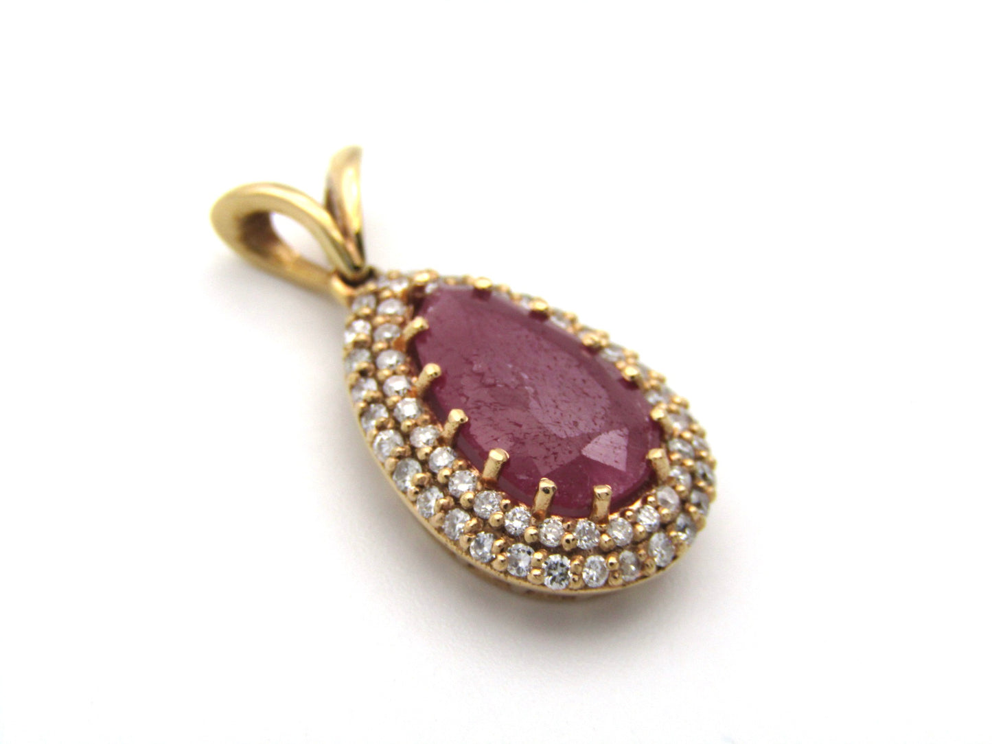 18K gold ruby and diamond pendant.