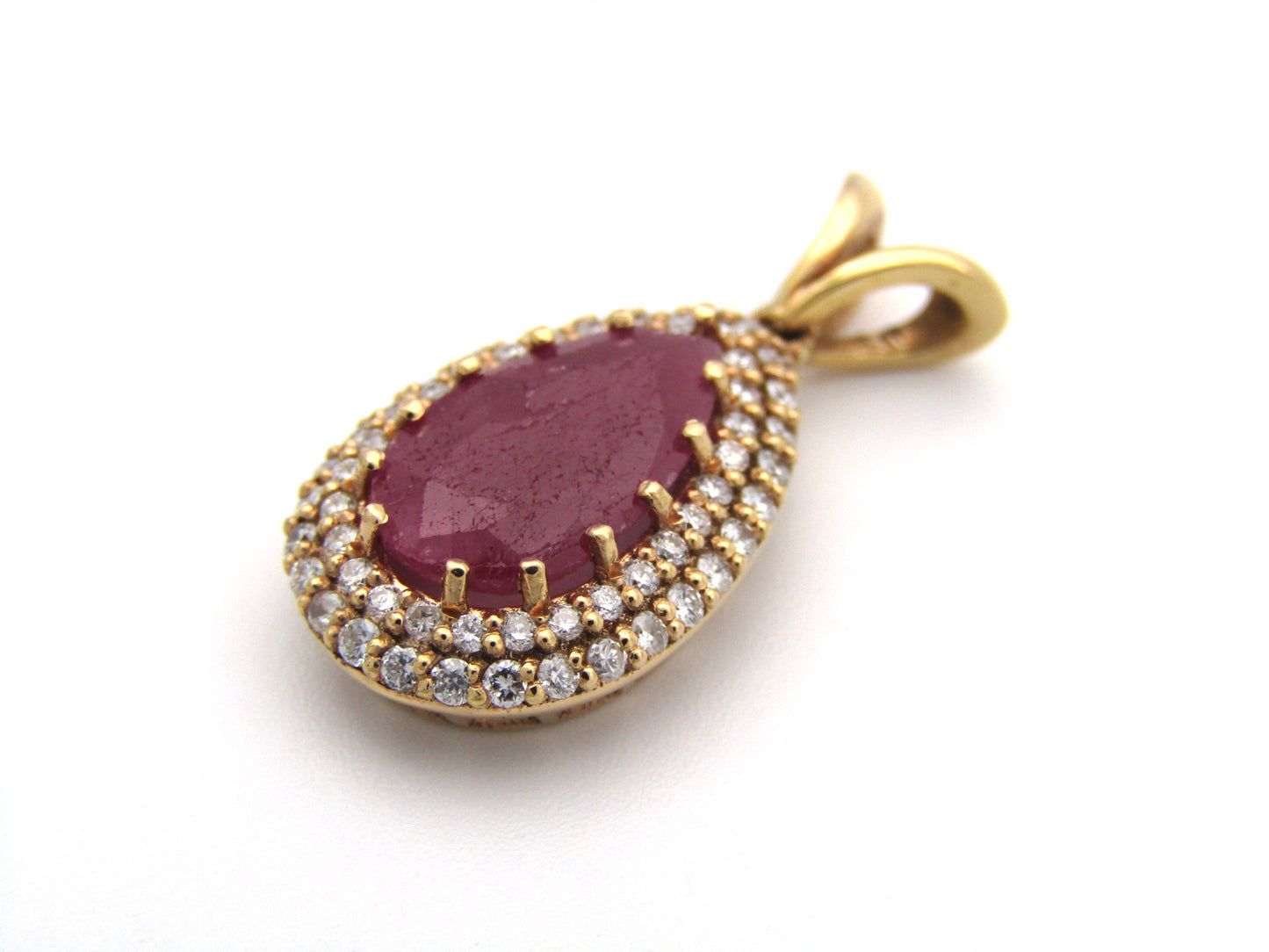18K gold ruby and diamond pendant.