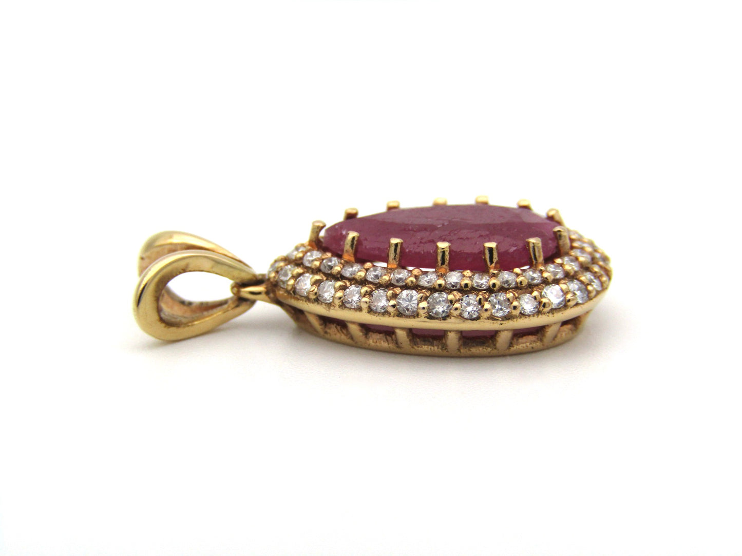 18K gold ruby and diamond pendant.