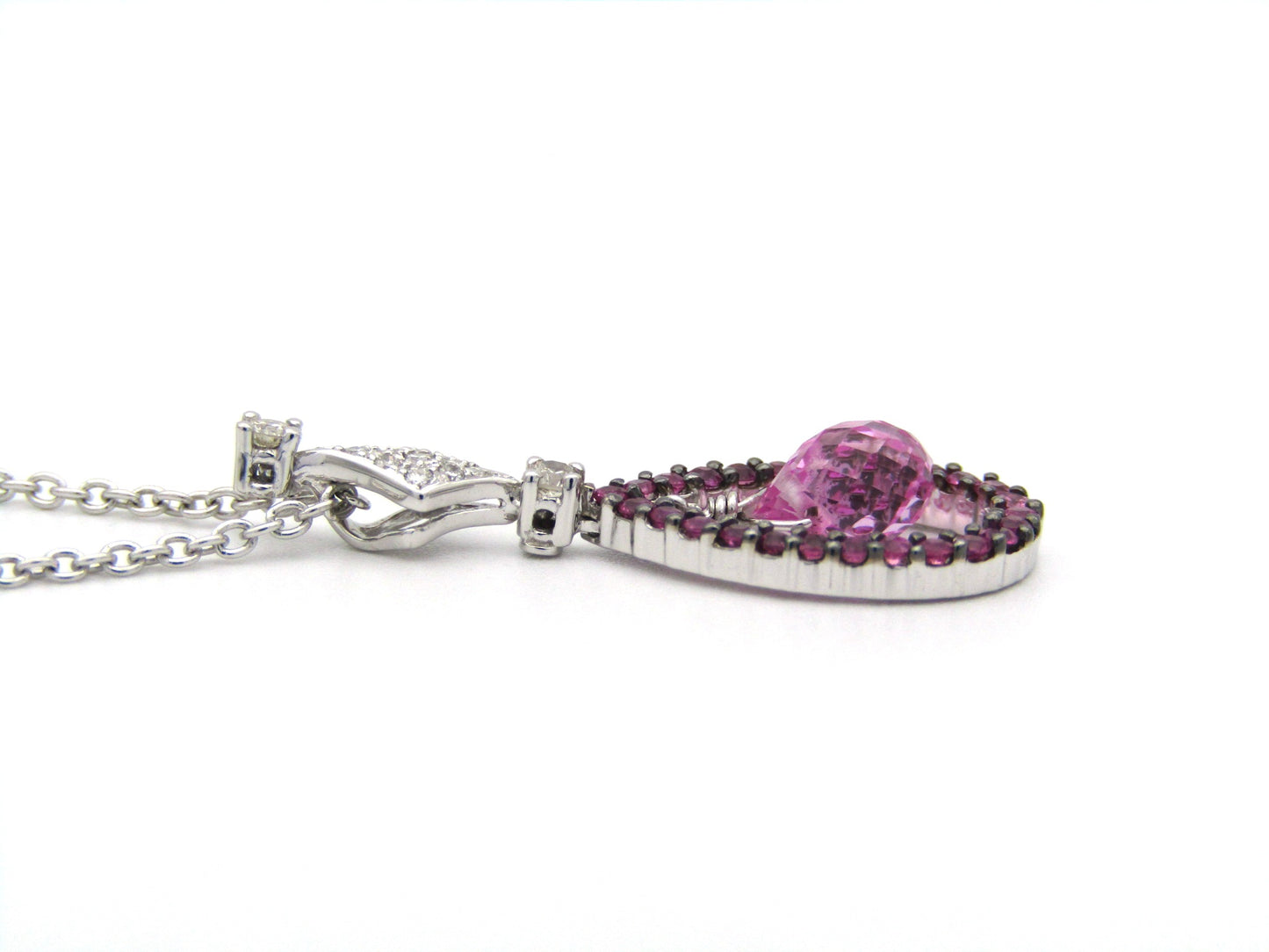 18K gold pink sapphire and diamond pendant.