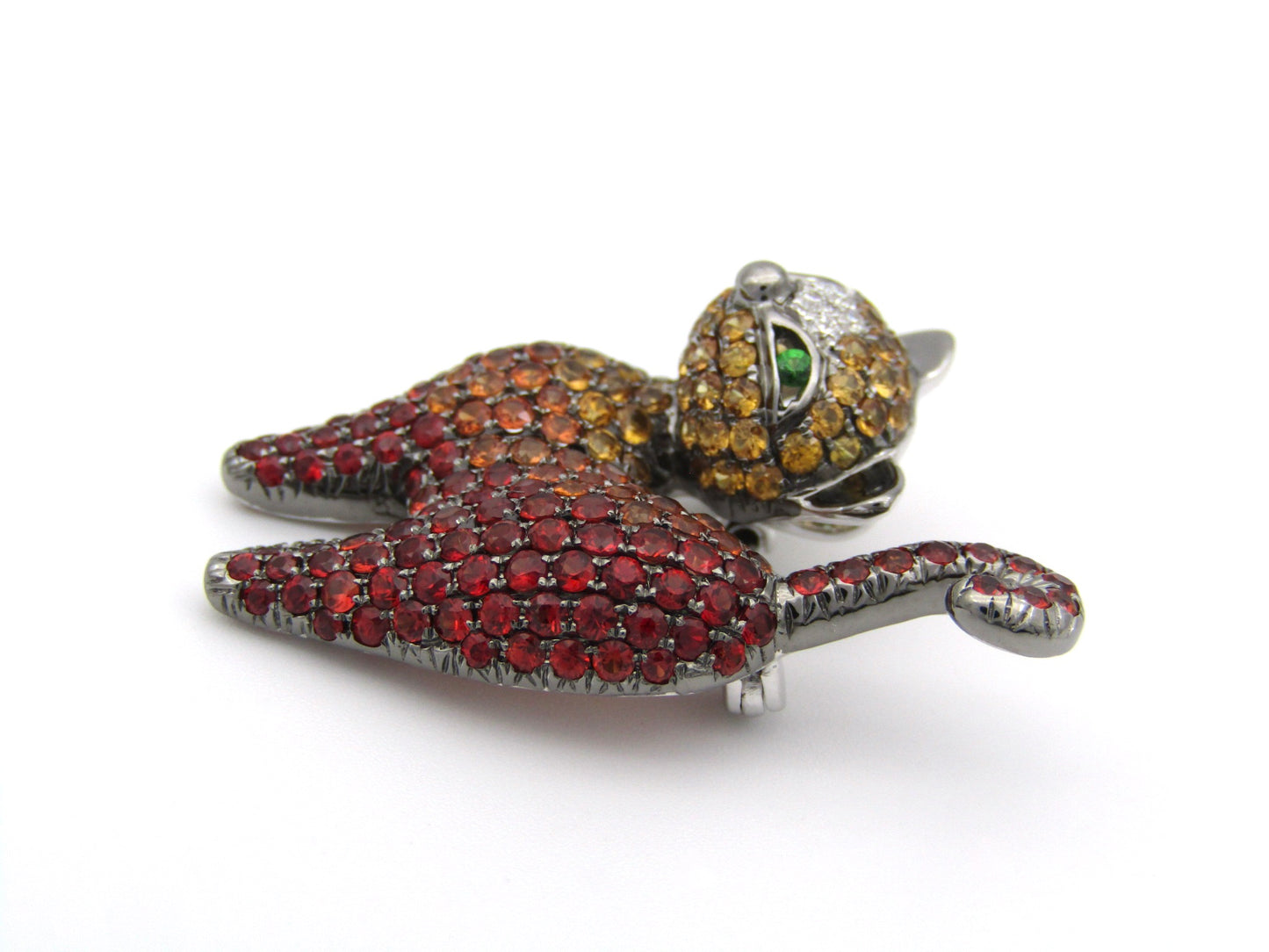 18K gold fancy sapphire, tsavorite garnet and diamond cat pendant/brooch.