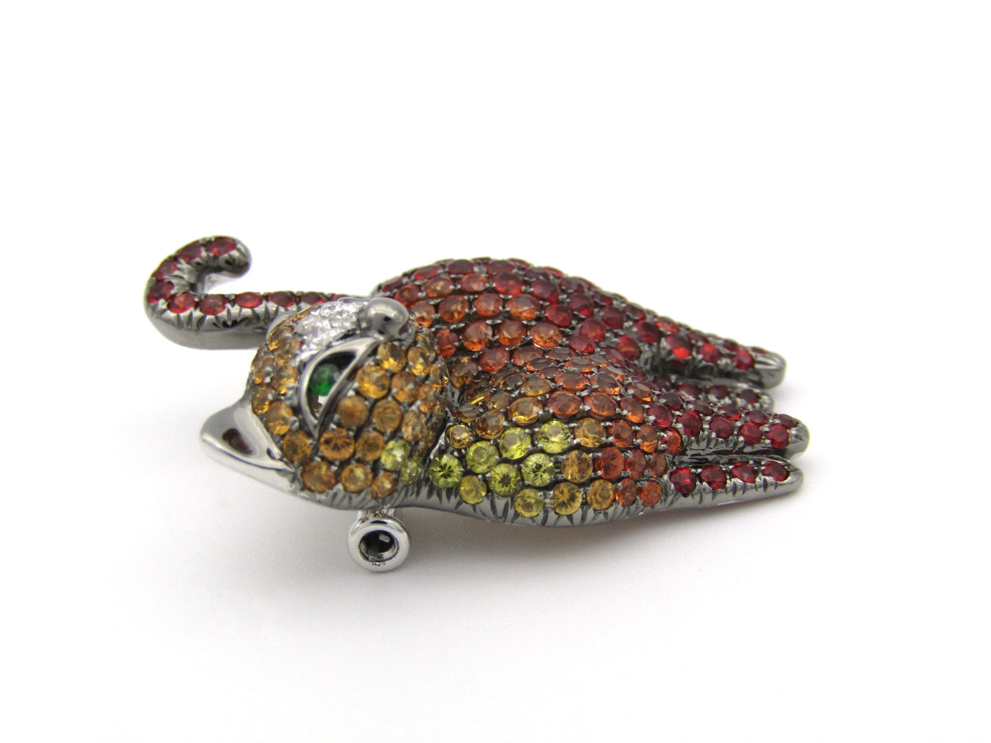 18K gold fancy sapphire, tsavorite garnet and diamond cat pendant/brooch.