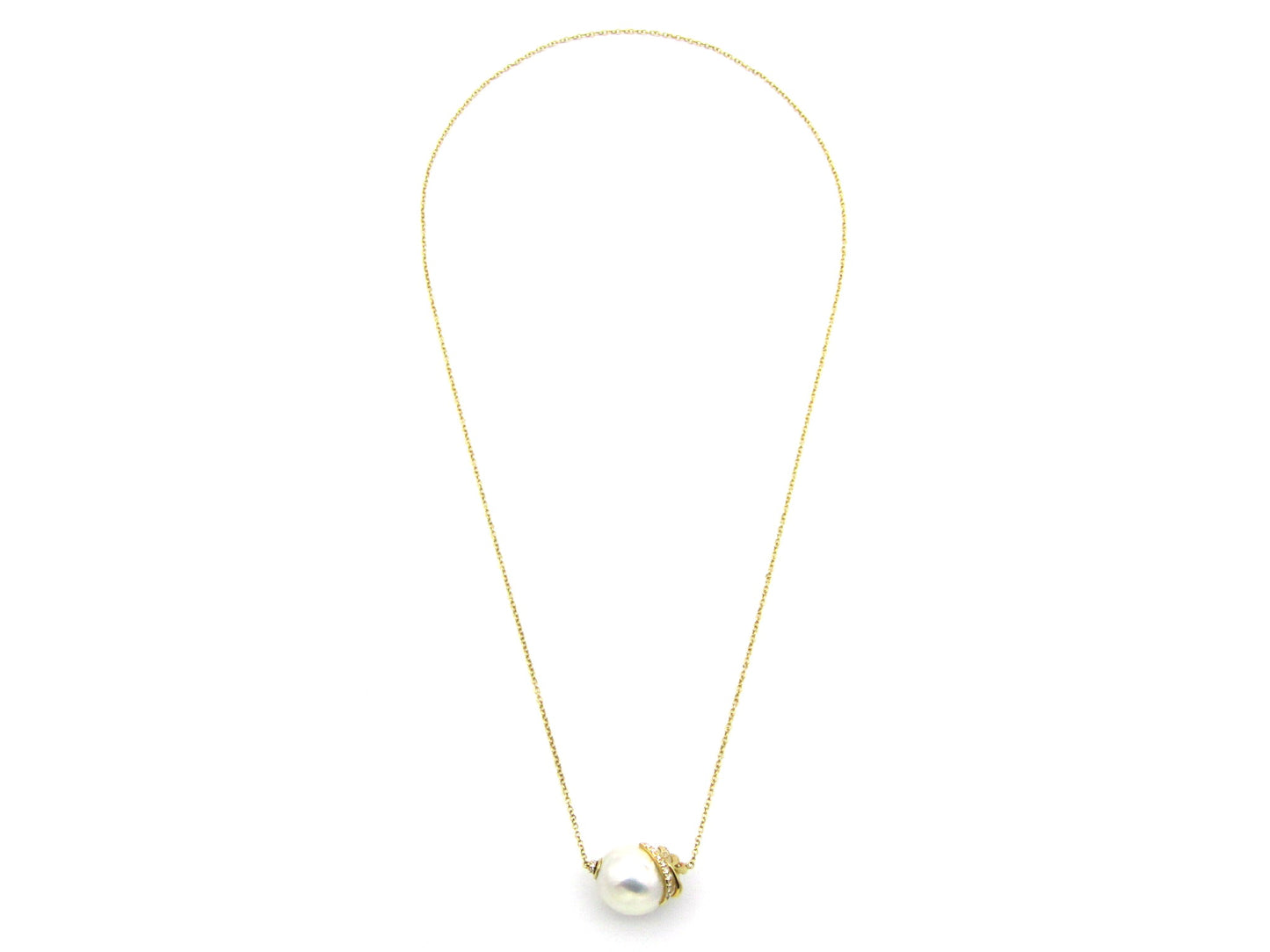 14K gold baroque pearl and diamond floating necklace.