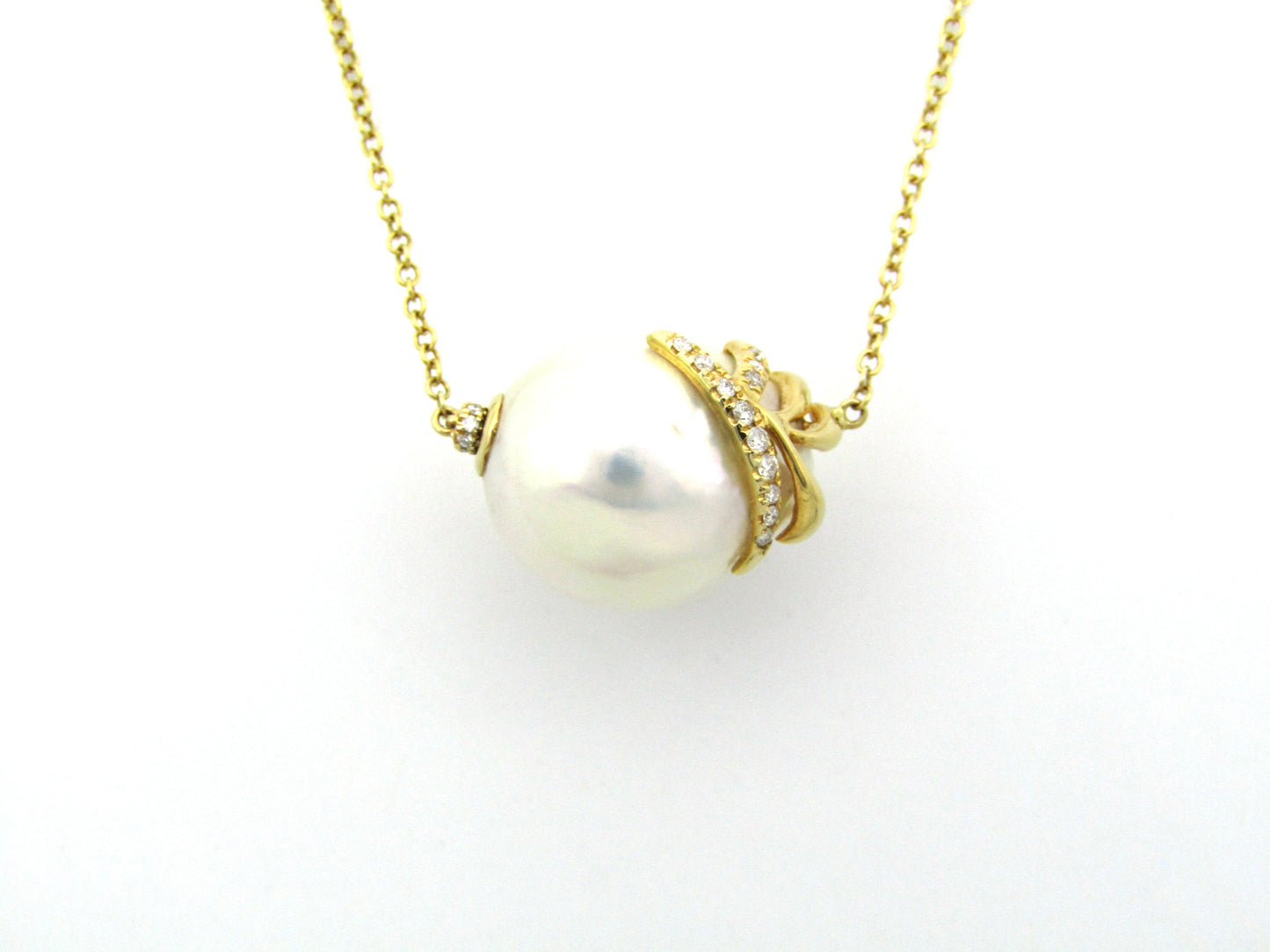 14K gold baroque pearl and diamond floating necklace.