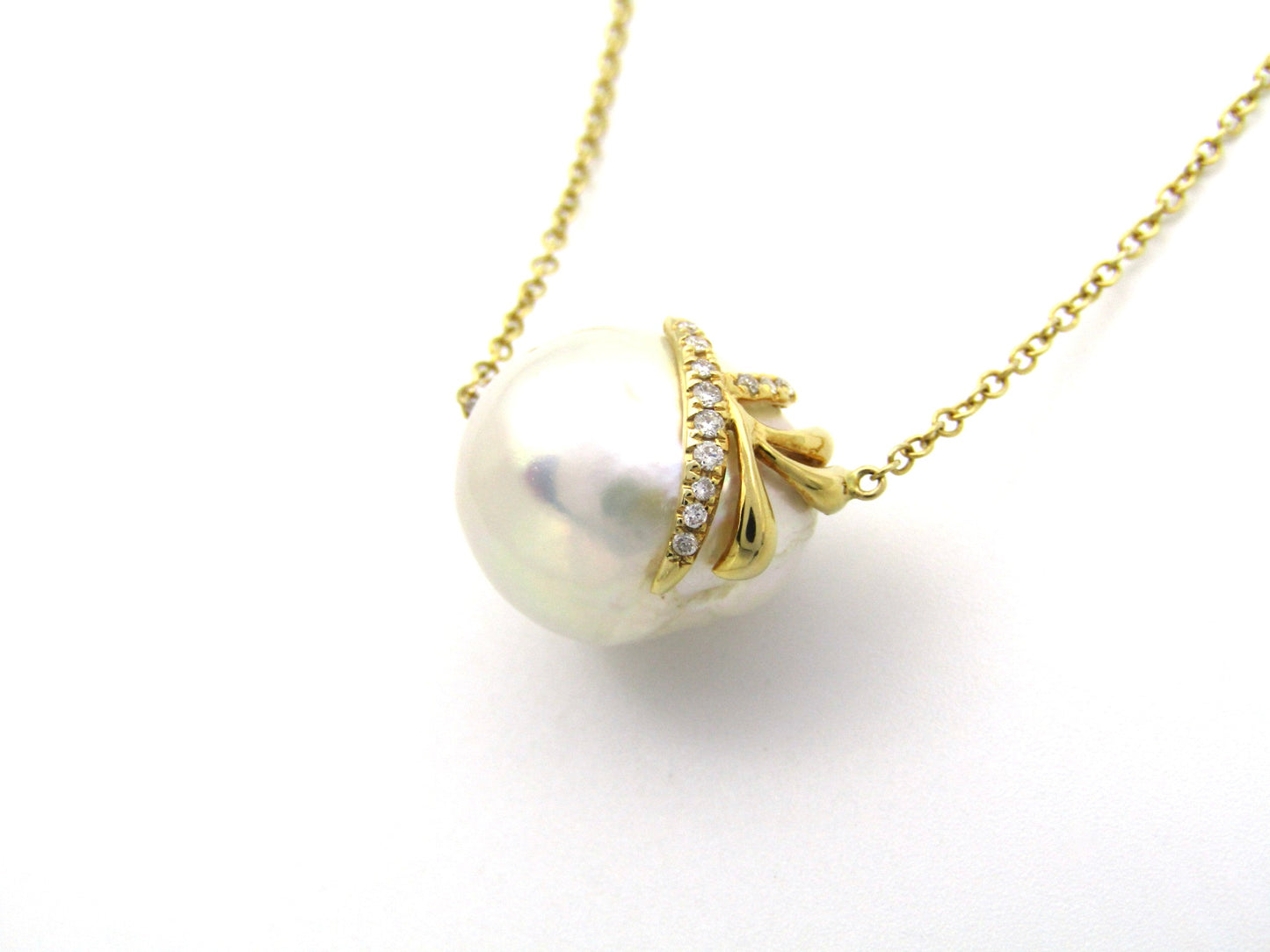 14K gold baroque pearl and diamond floating necklace.