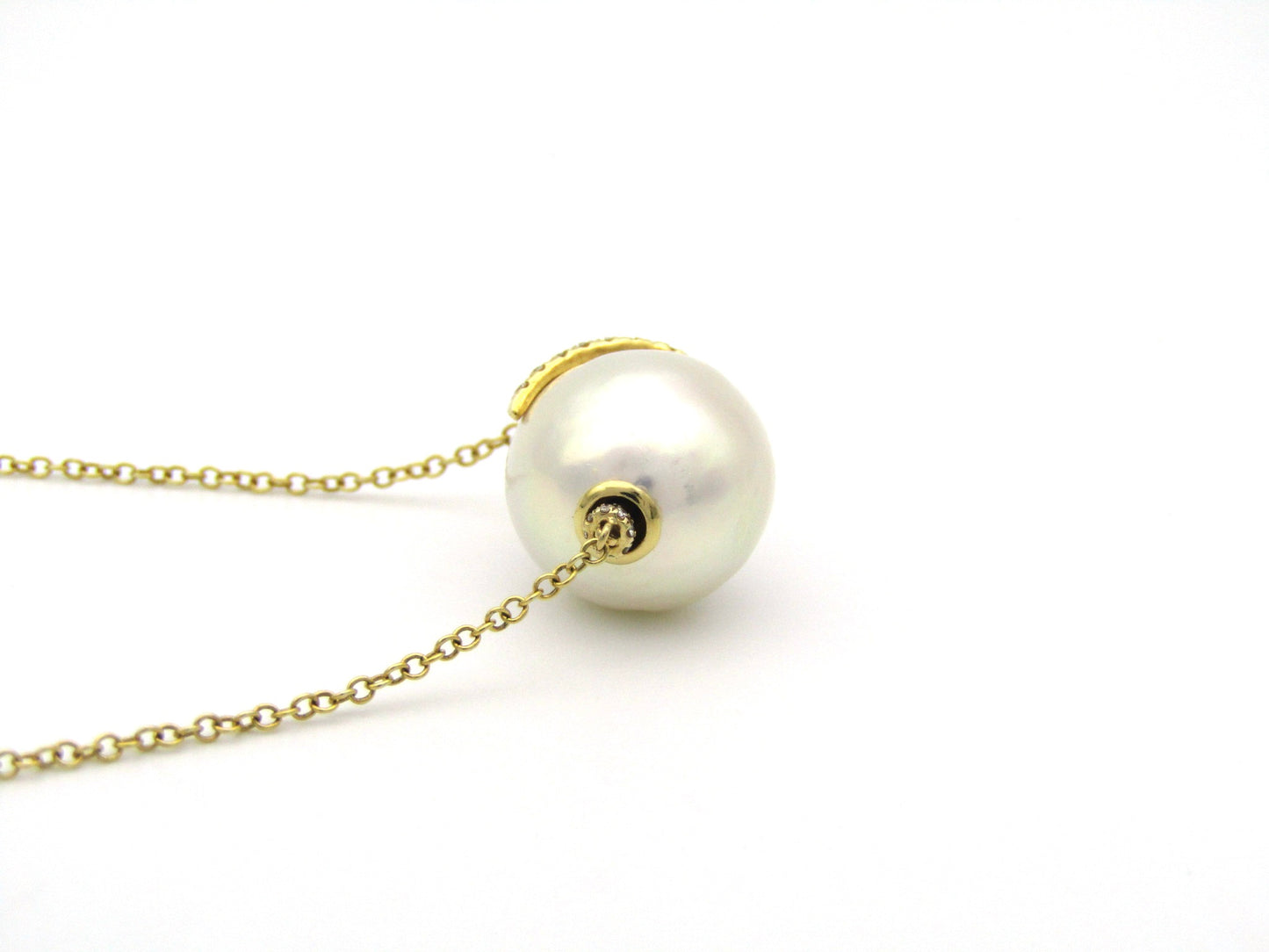 14K gold baroque pearl and diamond floating necklace.