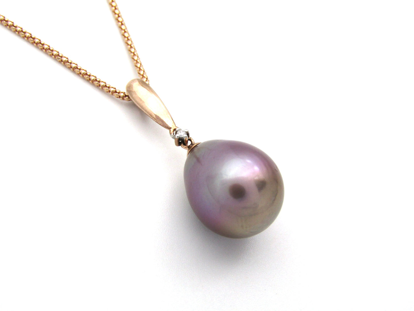 9K gold freshwater pearl and diamond pendant with 18K gold chain.
