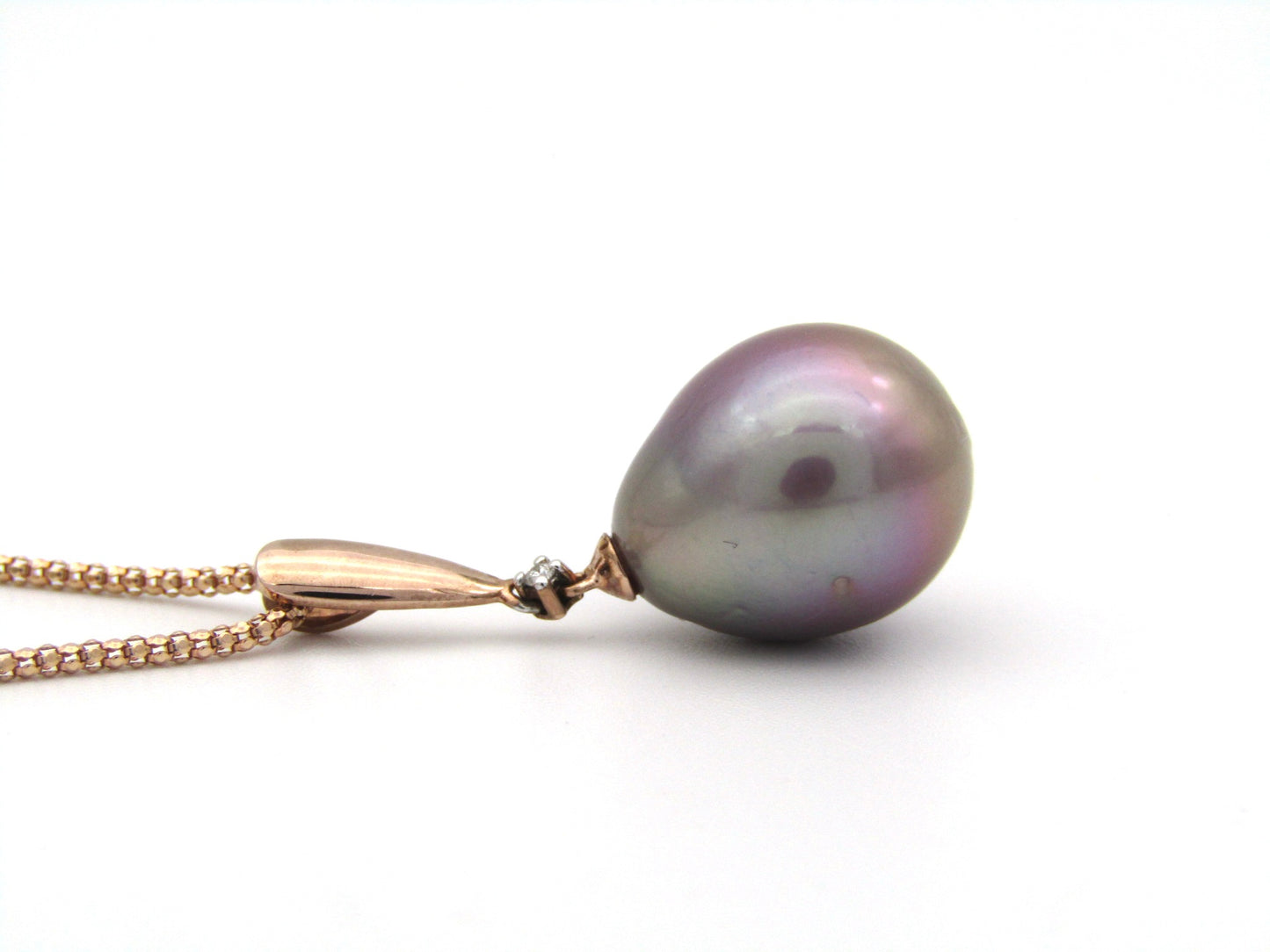 9K gold freshwater pearl and diamond pendant with 18K gold chain.