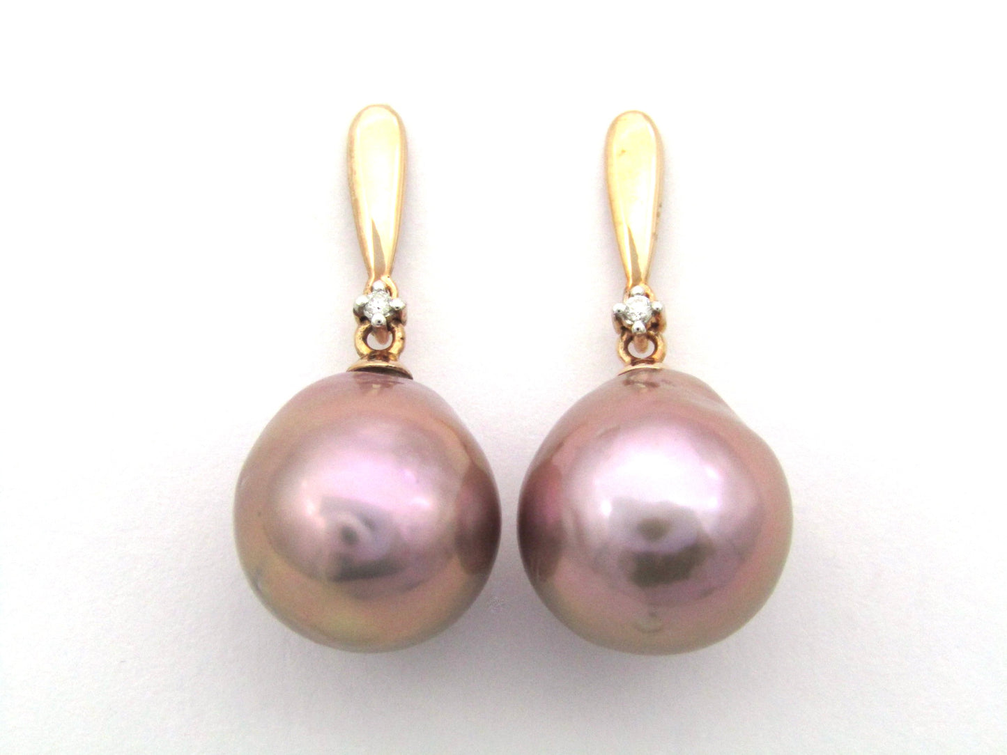 9K gold freshwater pearl and diamond dangle earrings.