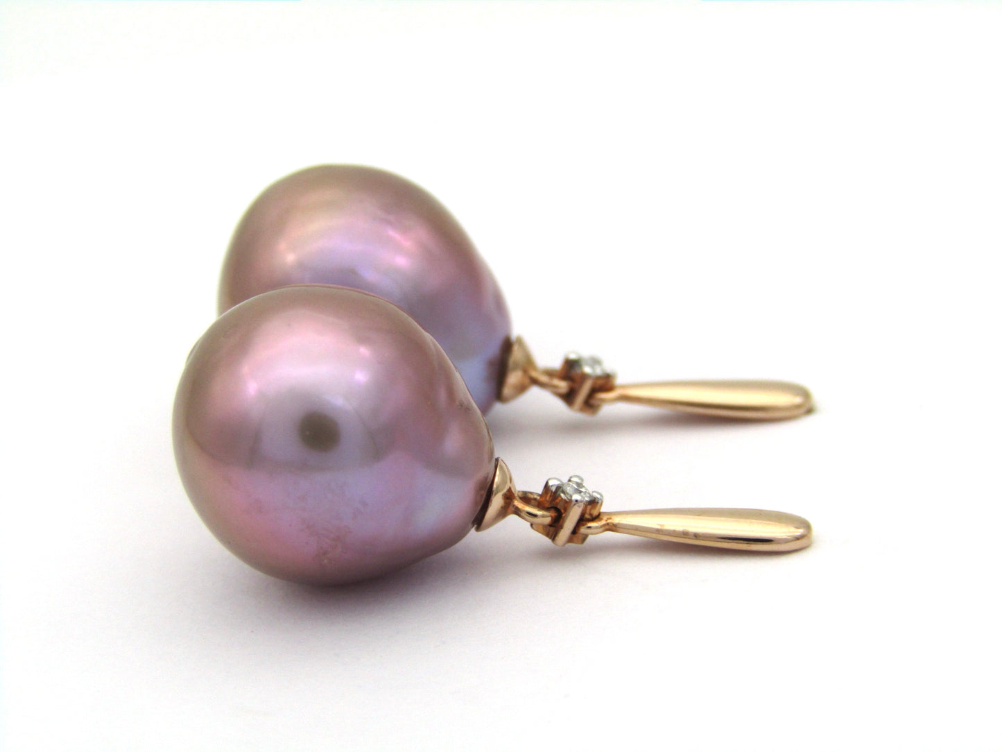 9K gold freshwater pearl and diamond dangle earrings.