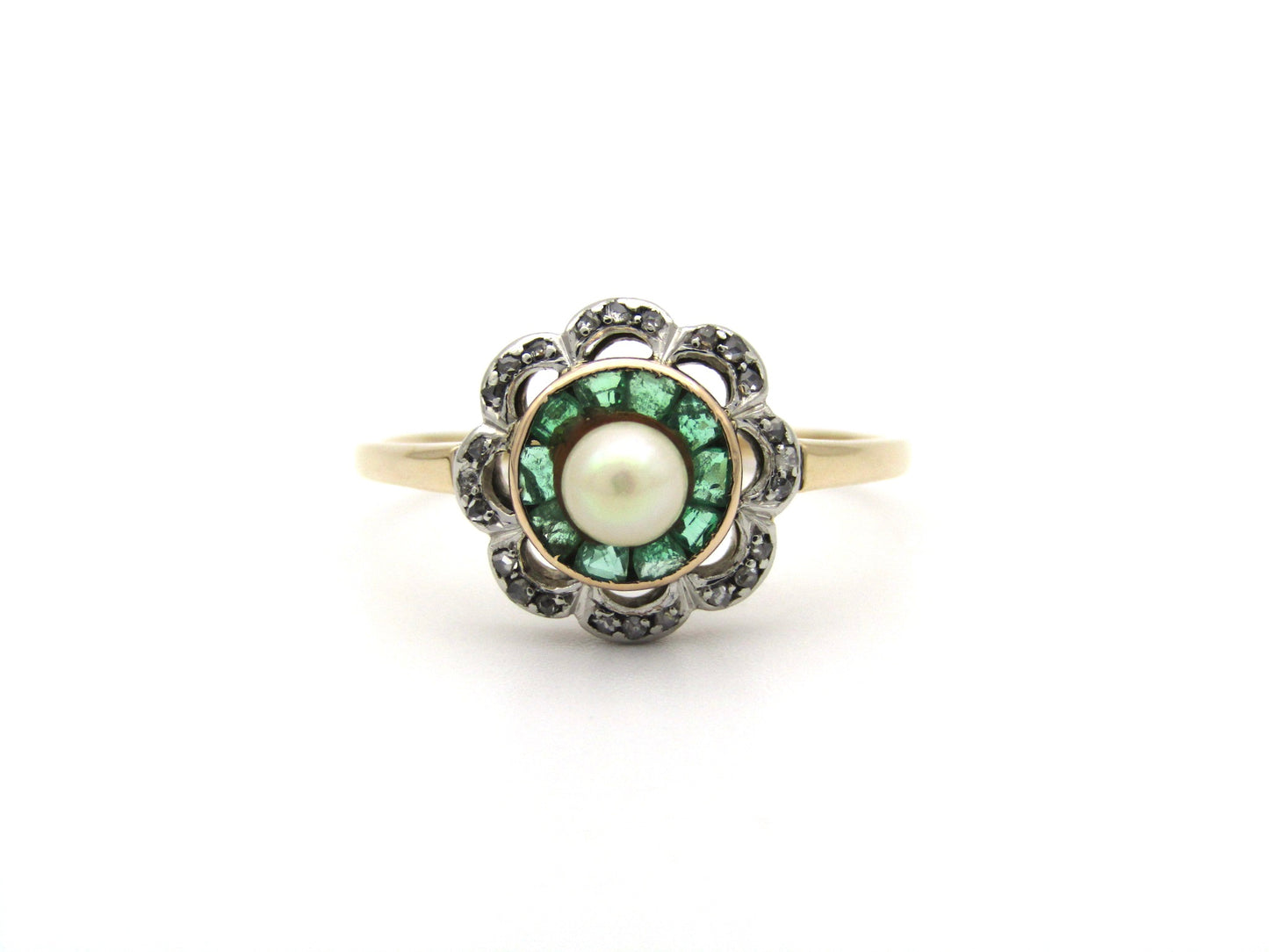 9K gold Edwardian pearl, emerald, and diamond flower ring.