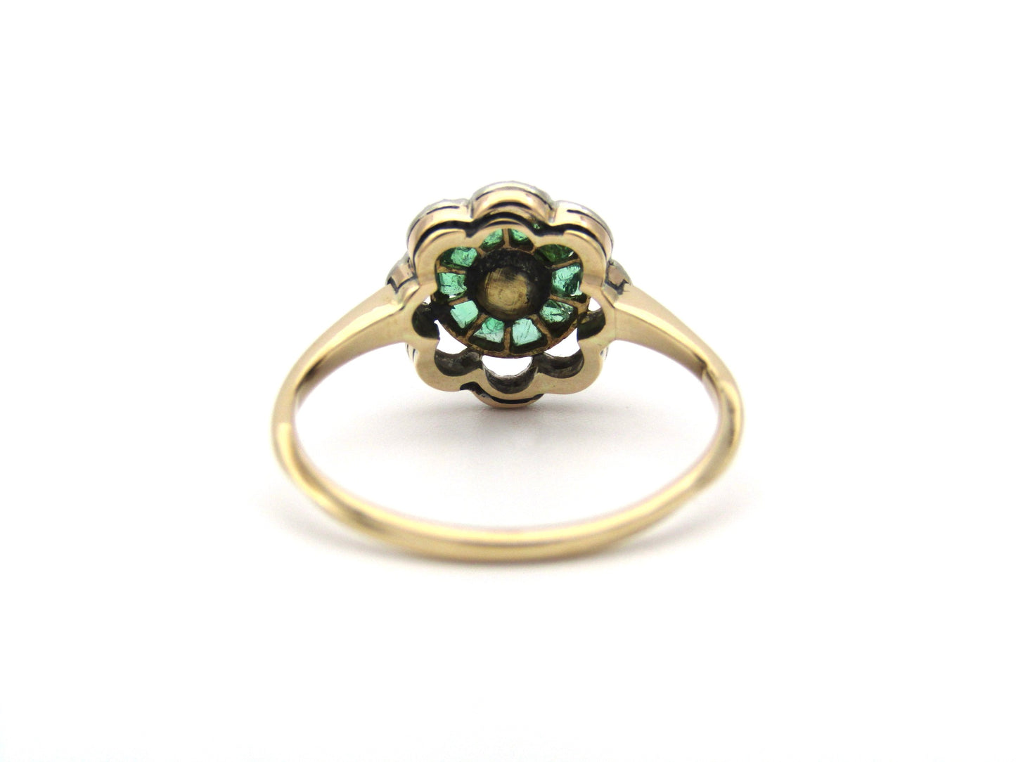 9K gold Edwardian pearl, emerald, and diamond flower ring.