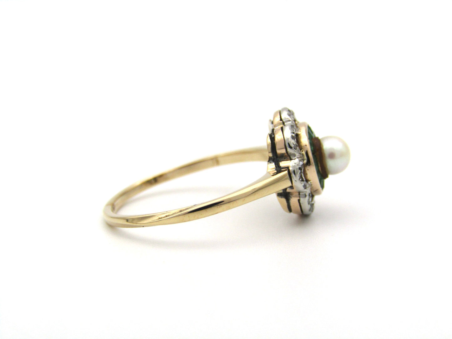 9K gold Edwardian pearl, emerald, and diamond flower ring.