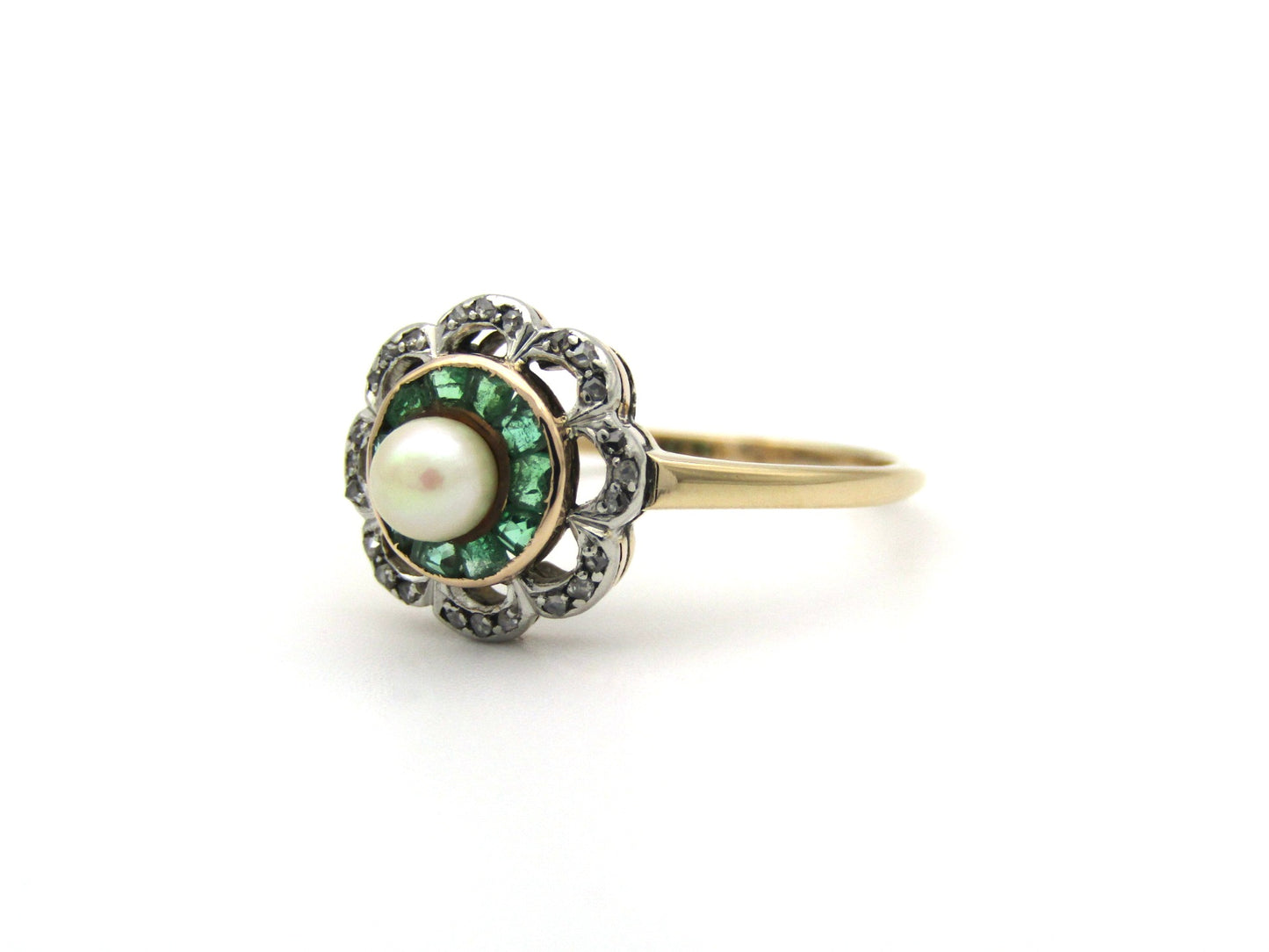 9K gold Edwardian pearl, emerald, and diamond flower ring.