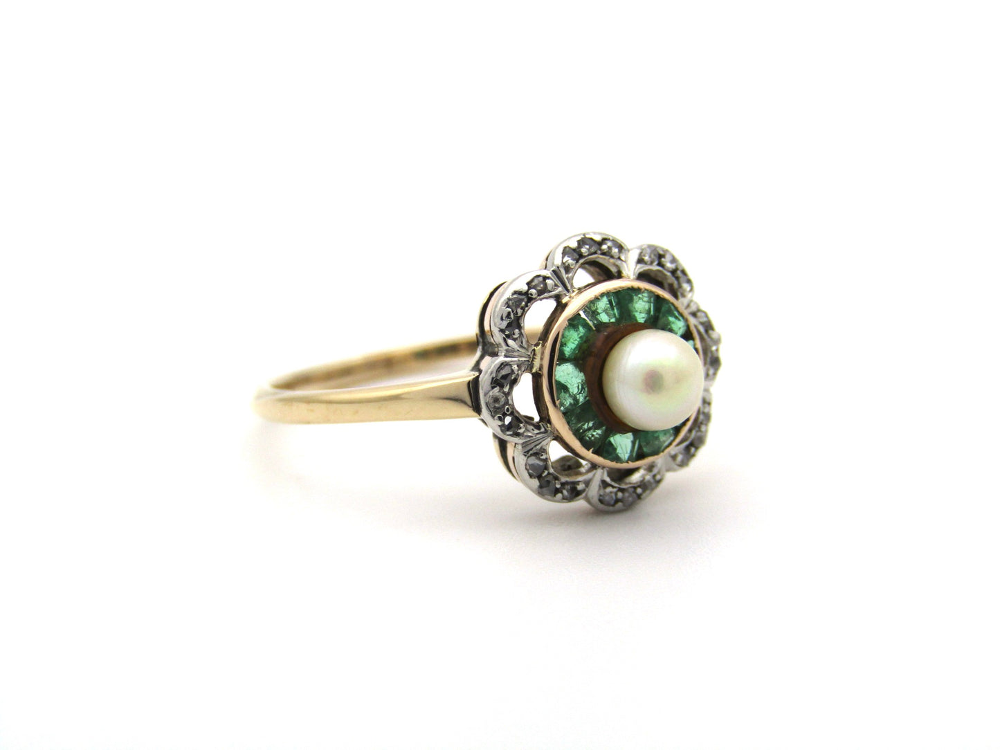 9K gold Edwardian pearl, emerald, and diamond flower ring.