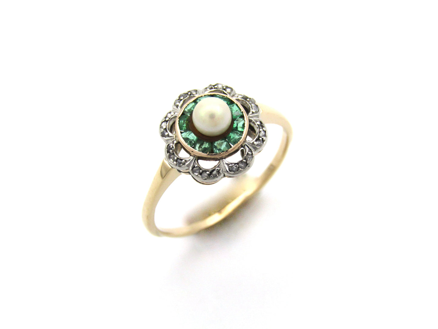 9K gold Edwardian pearl, emerald, and diamond flower ring.