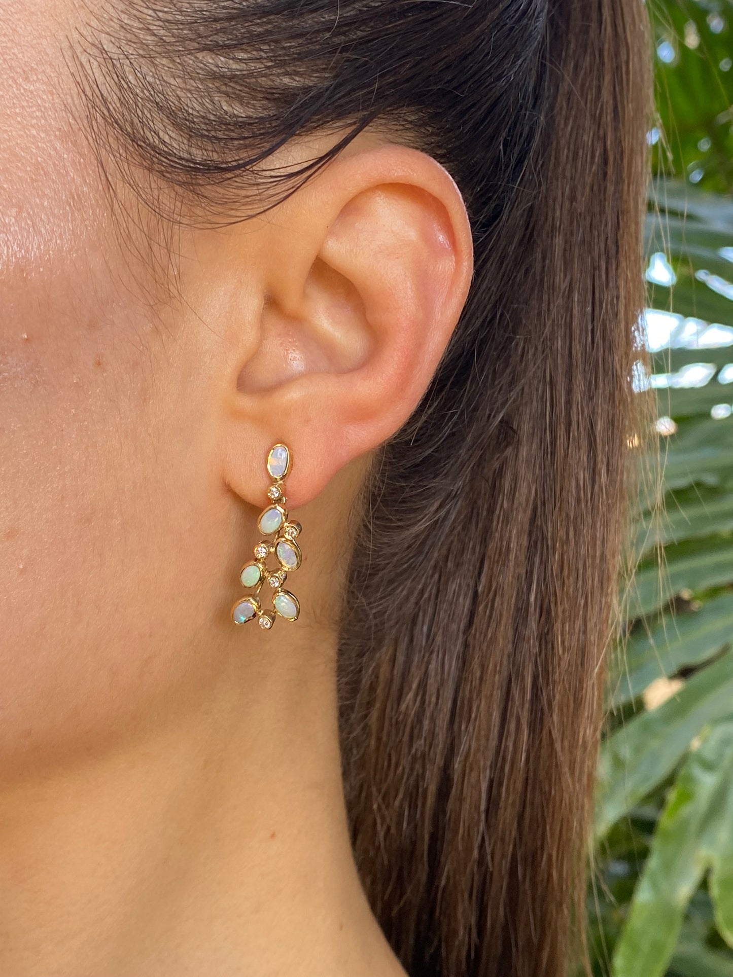 14K gold opal and diamond drop earrings.