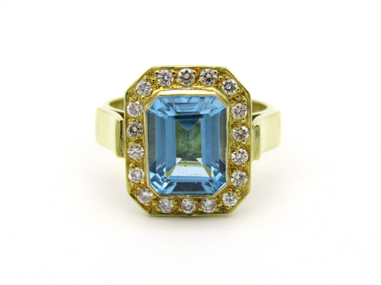 18kt yellow gold blue topaz and diamond ring.