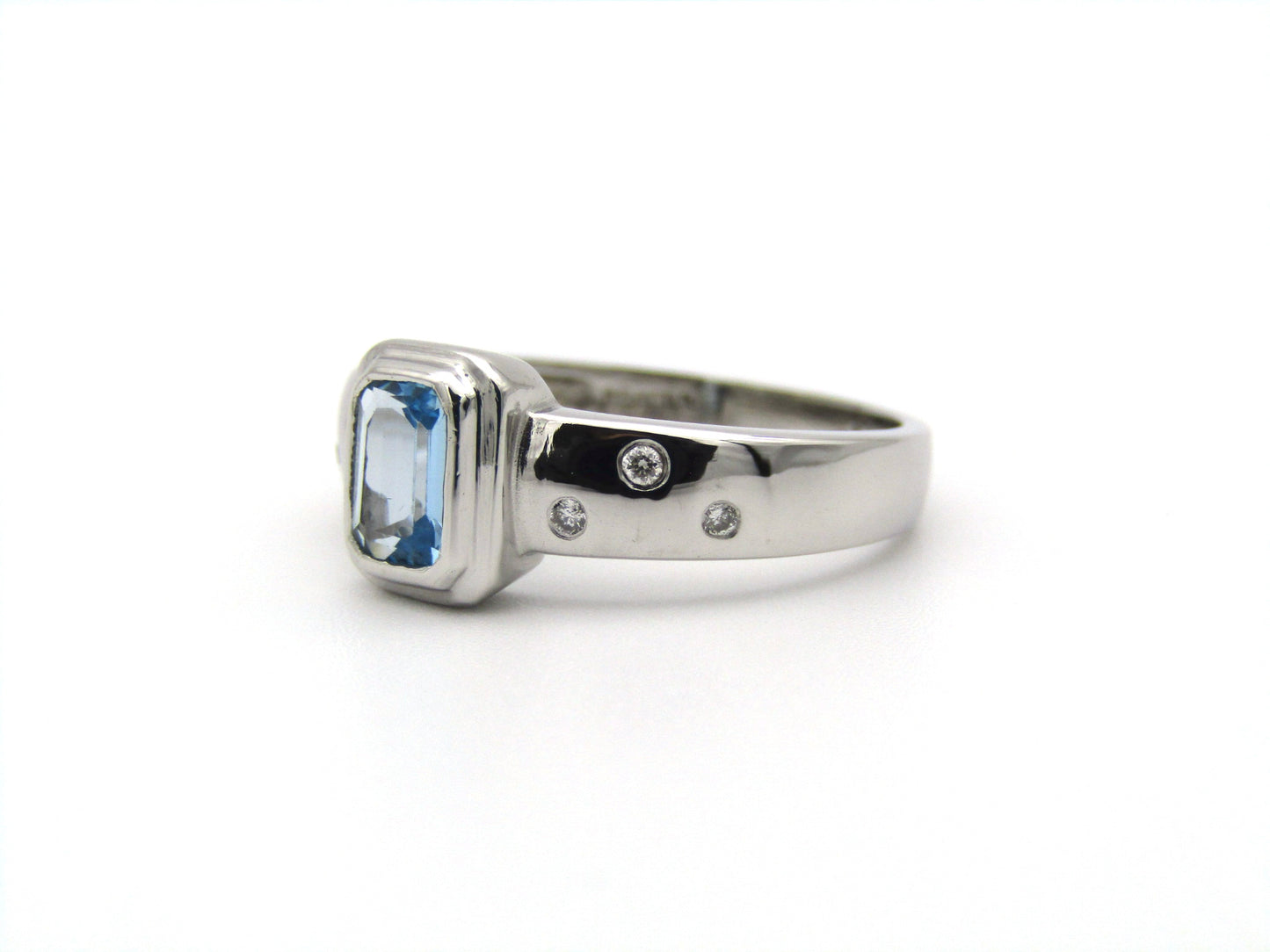 9K gold blue topaz and diamond ring by Browns.