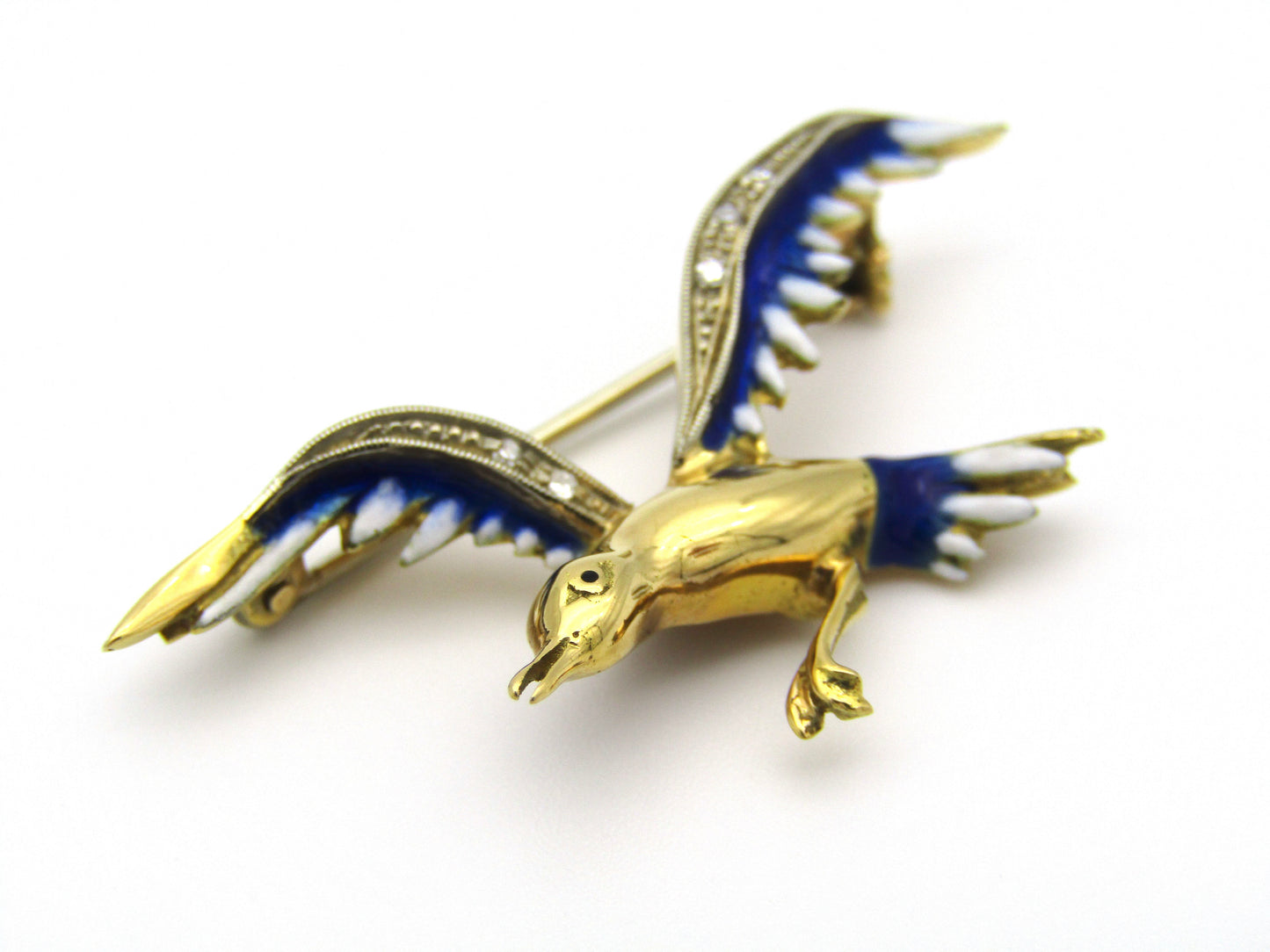 18kt gold diamond and enamel "Bird in flight" brooch.
