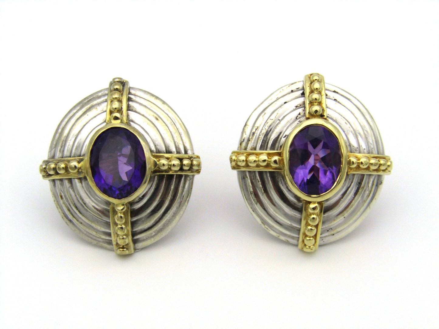 A pair of 18kt and 9kt gold amethyst earrings.