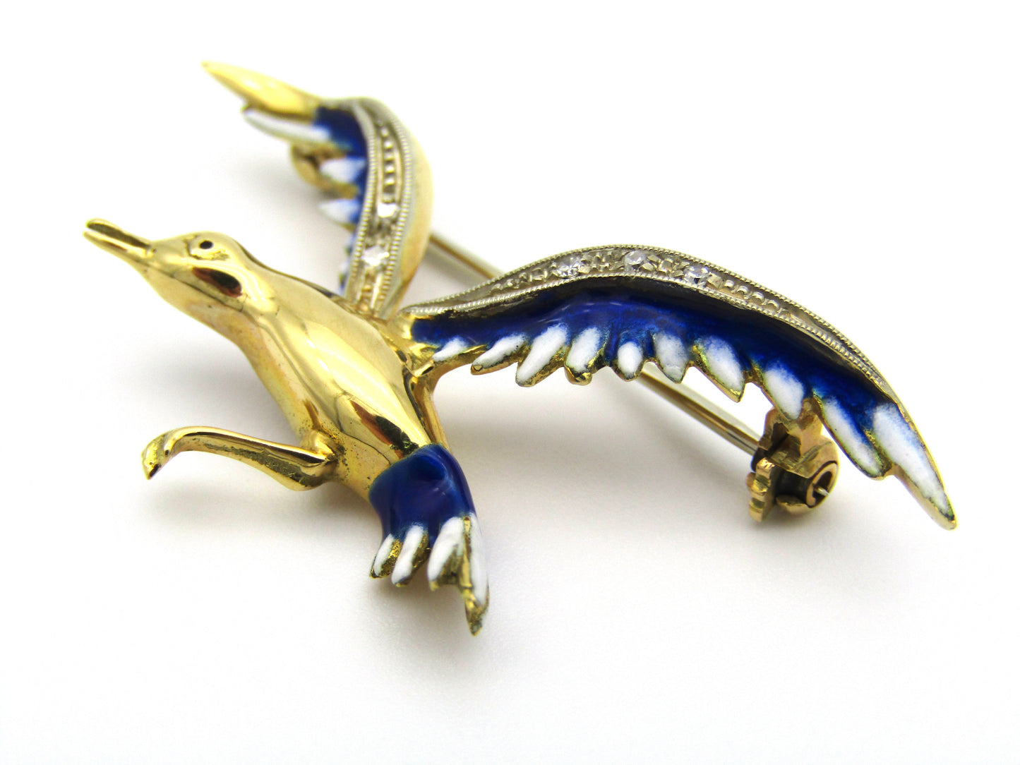 18kt gold diamond and enamel "Bird in flight" brooch.