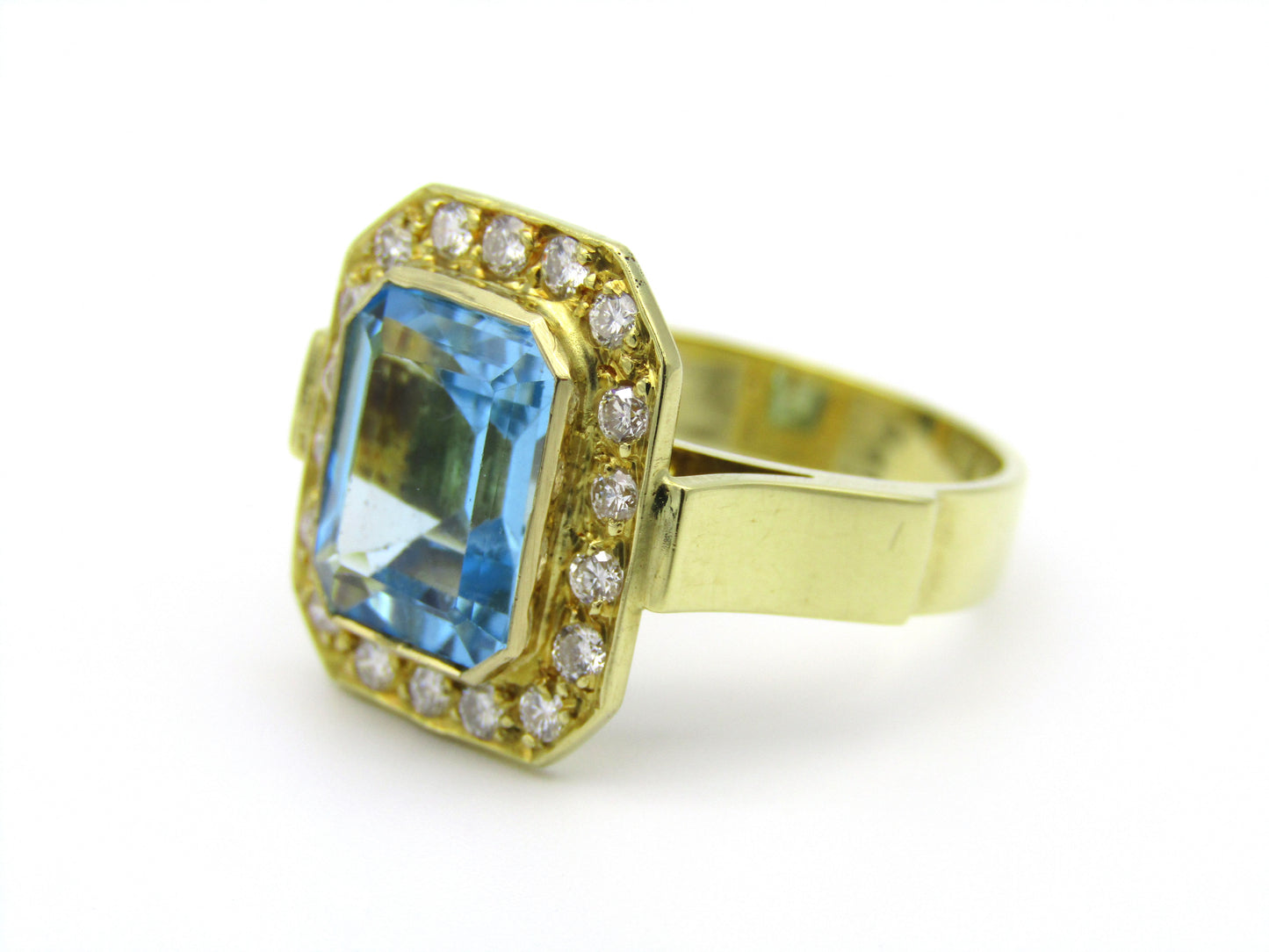 18kt yellow gold blue topaz and diamond ring.