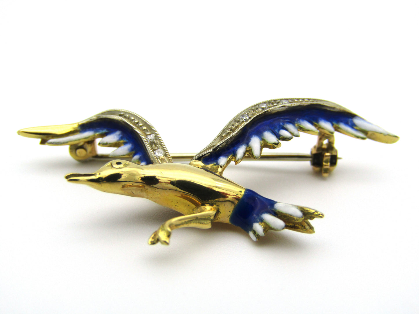18kt gold diamond and enamel "Bird in flight" brooch.