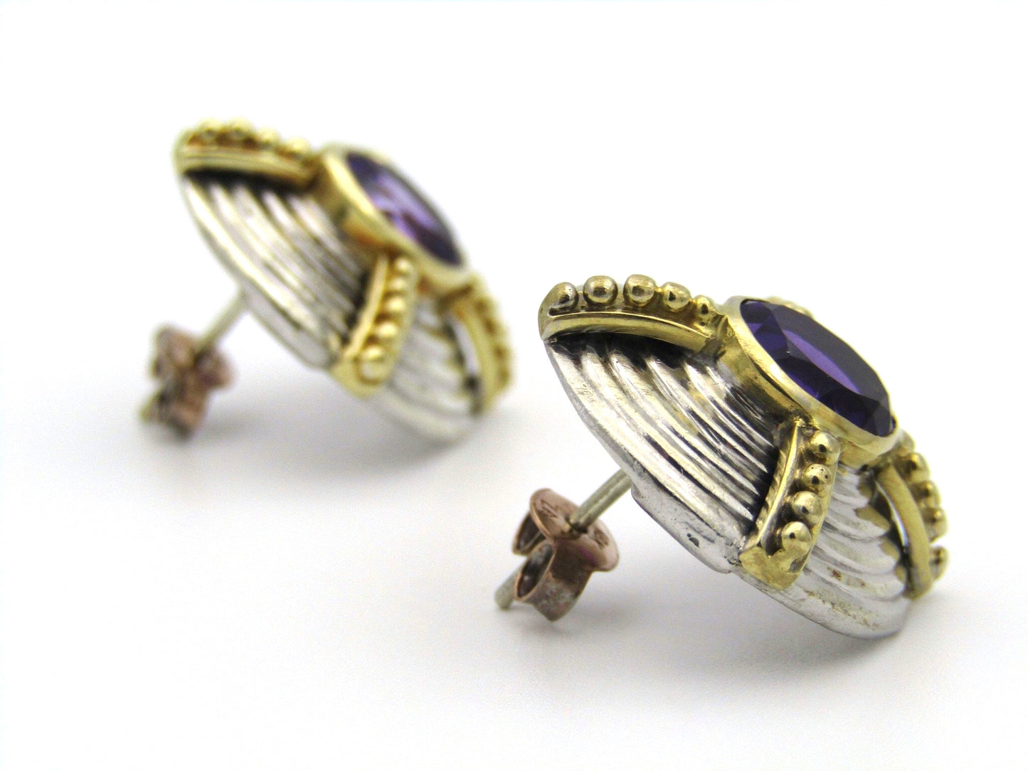 A pair of 18kt and 9kt gold amethyst earrings.
